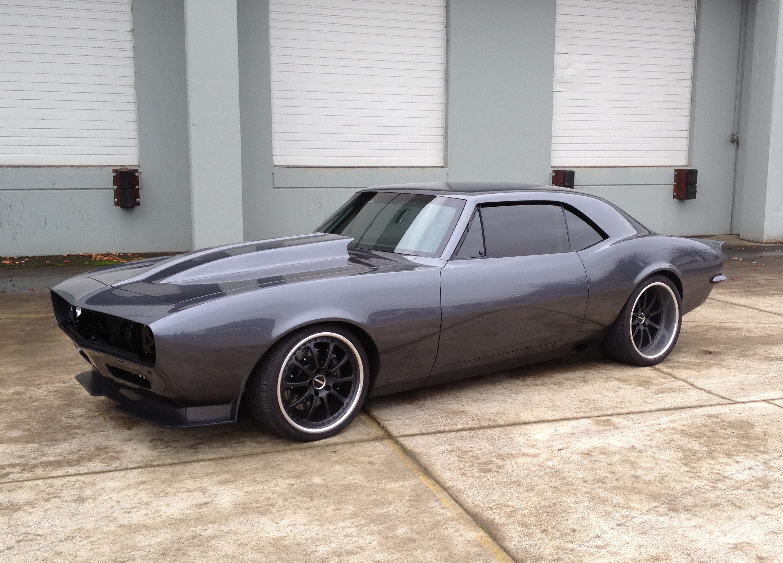 Customized dark gray Chevrolet Camaro parked outdoors HD Wallpaper