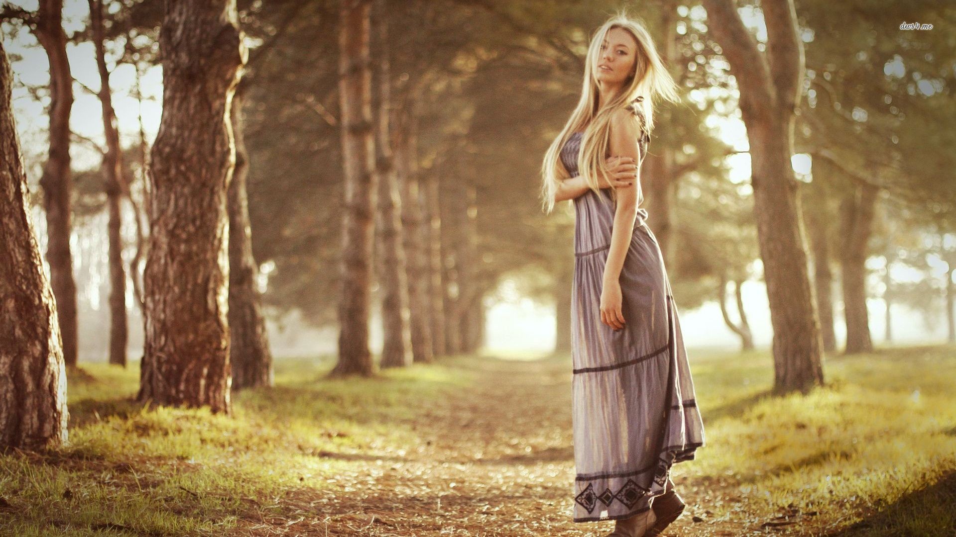 Blonde woman in a dress walking in a forest HD Wallpaper