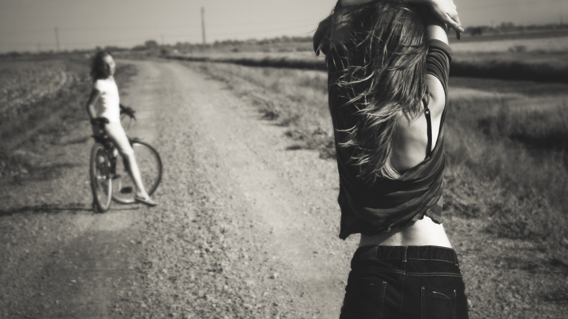 Two women on a dirt road HD Wallpaper