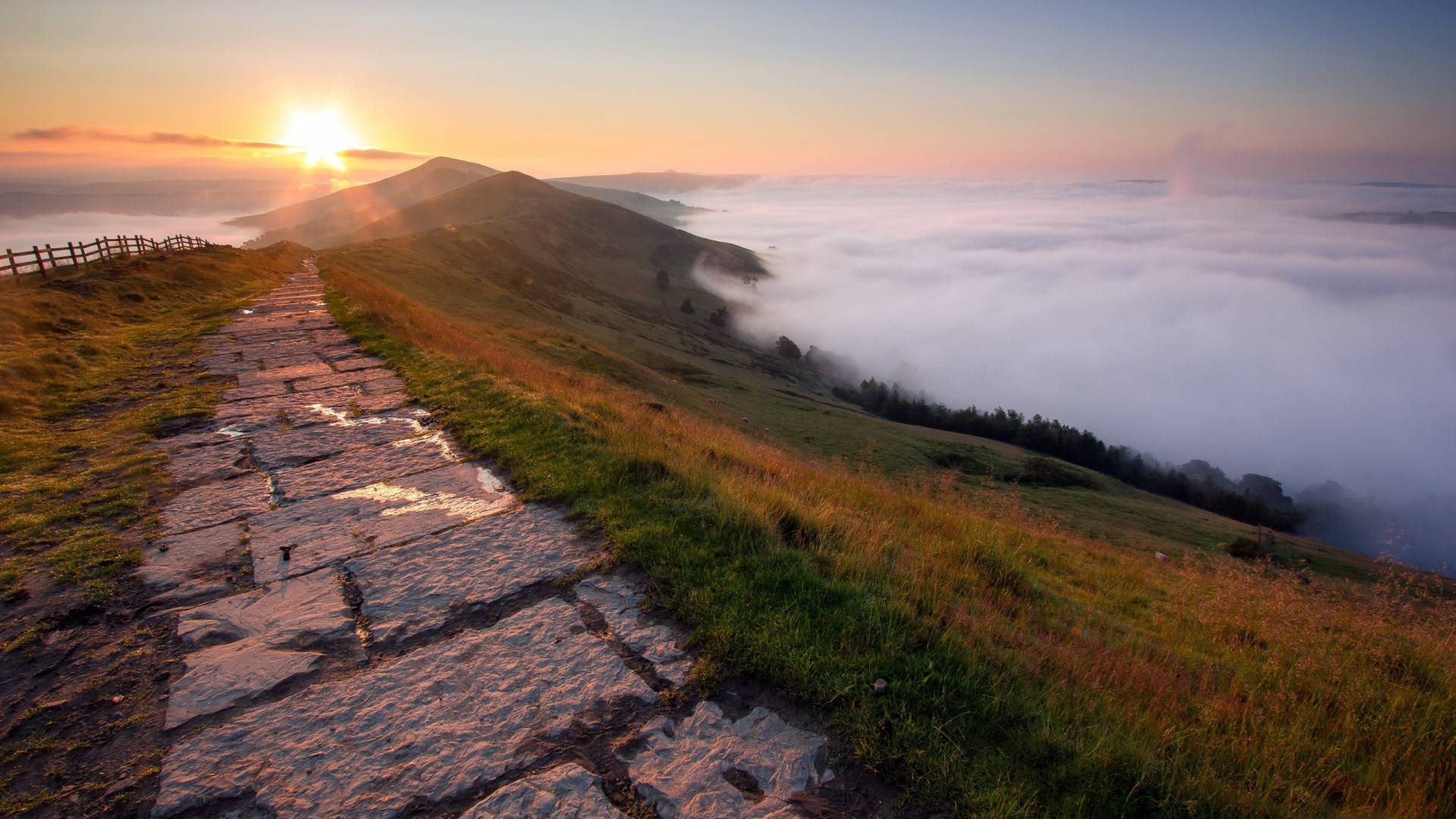 Stone path on a hill at sunset with fog HD Wallpaper