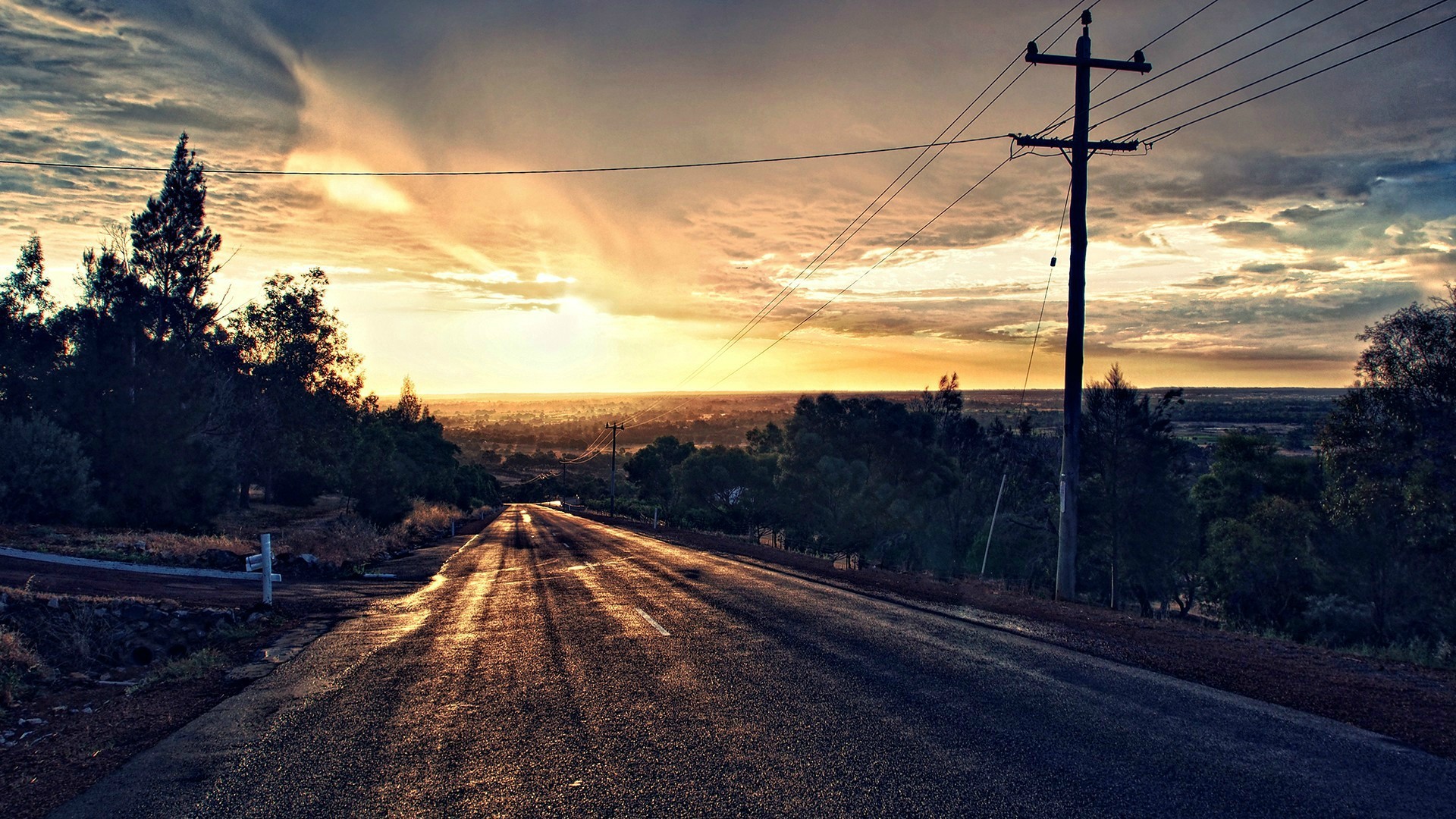 Road leading to sunset with power lines HD Wallpaper
