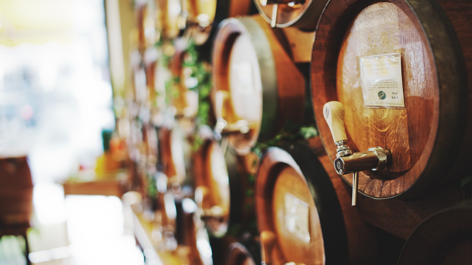 Wooden barrels with taps and labels HD Wallpaper