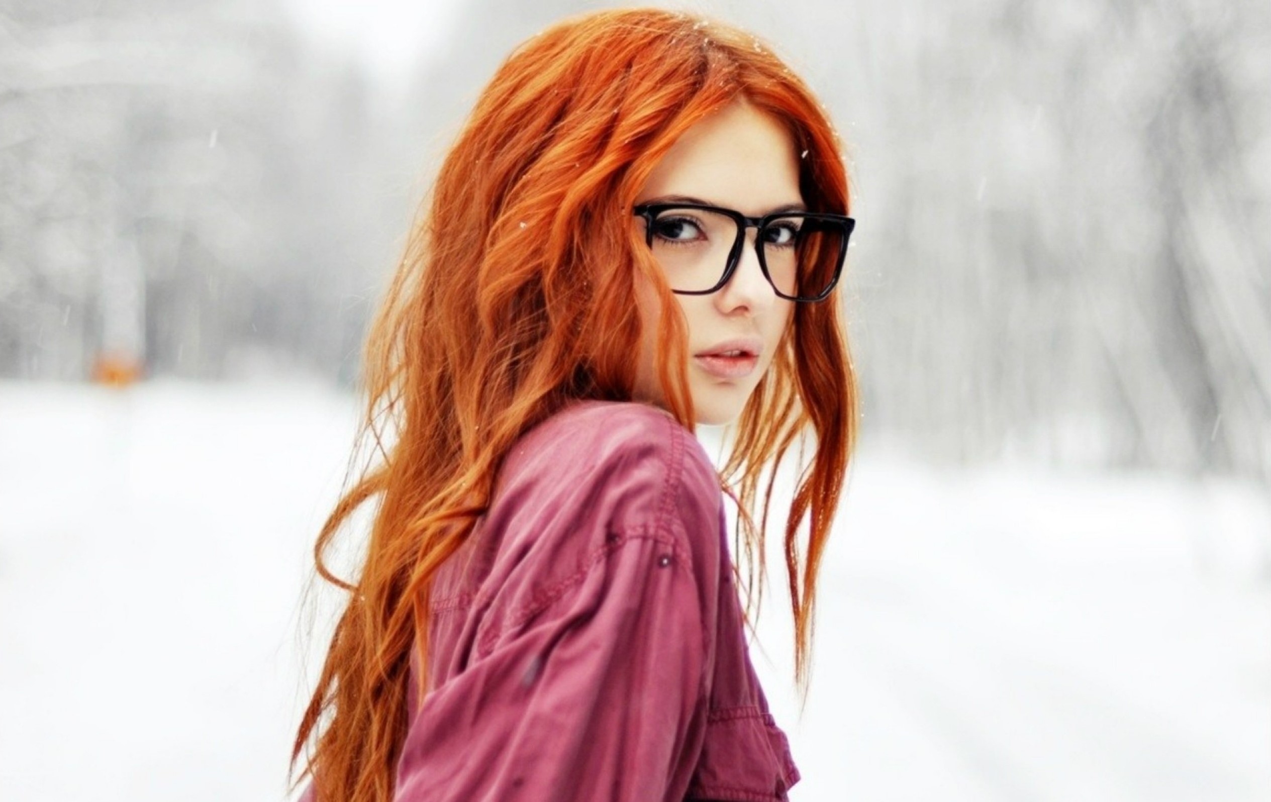 Redhead woman with glasses in the snow HD Wallpaper