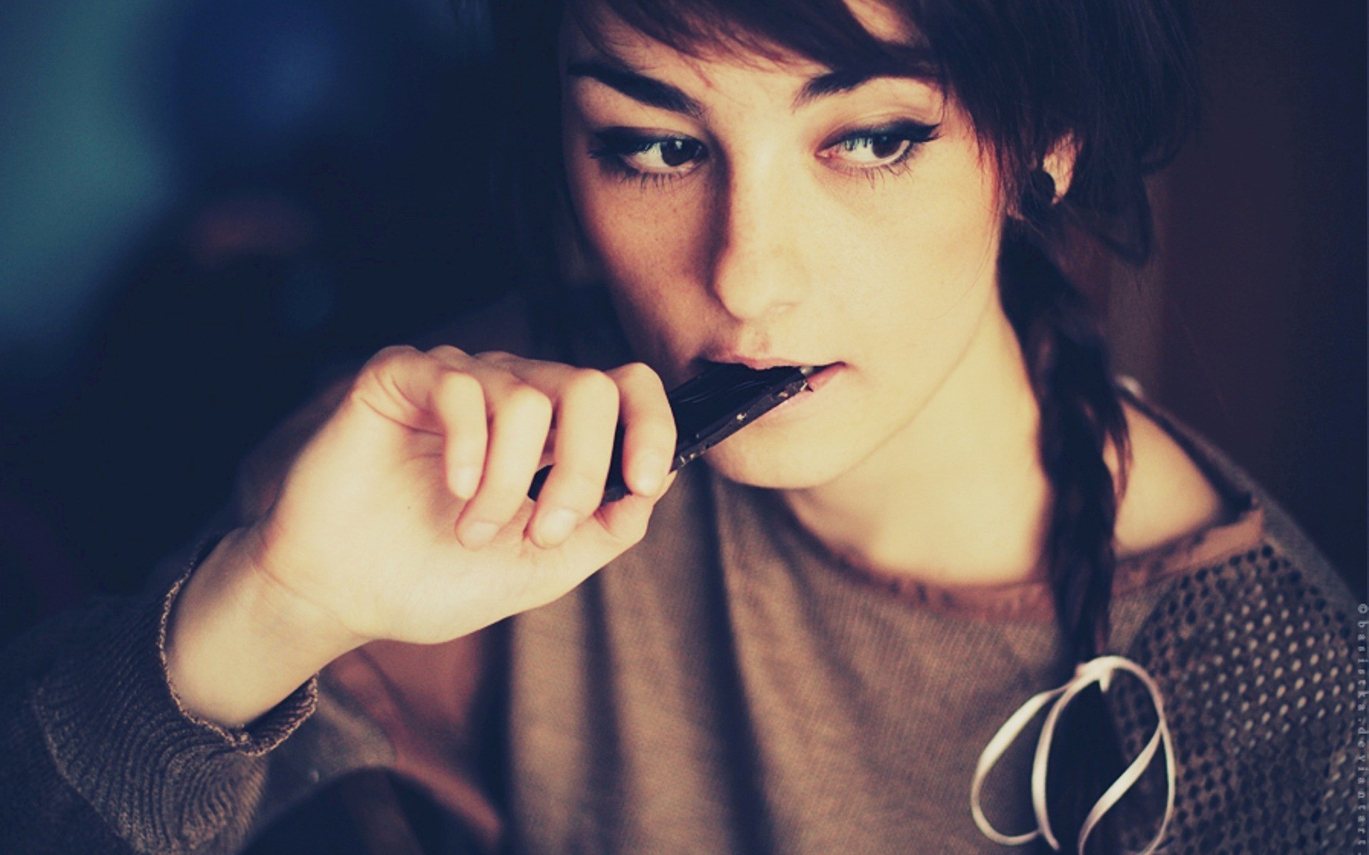 Woman eating chocolate bar HD Wallpaper