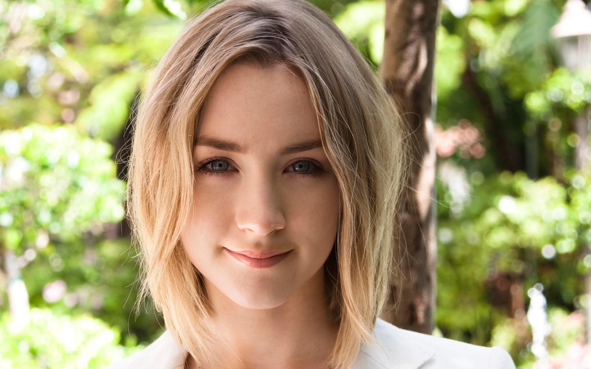 Saoirse Ronan smiling outdoors HD Wallpaper