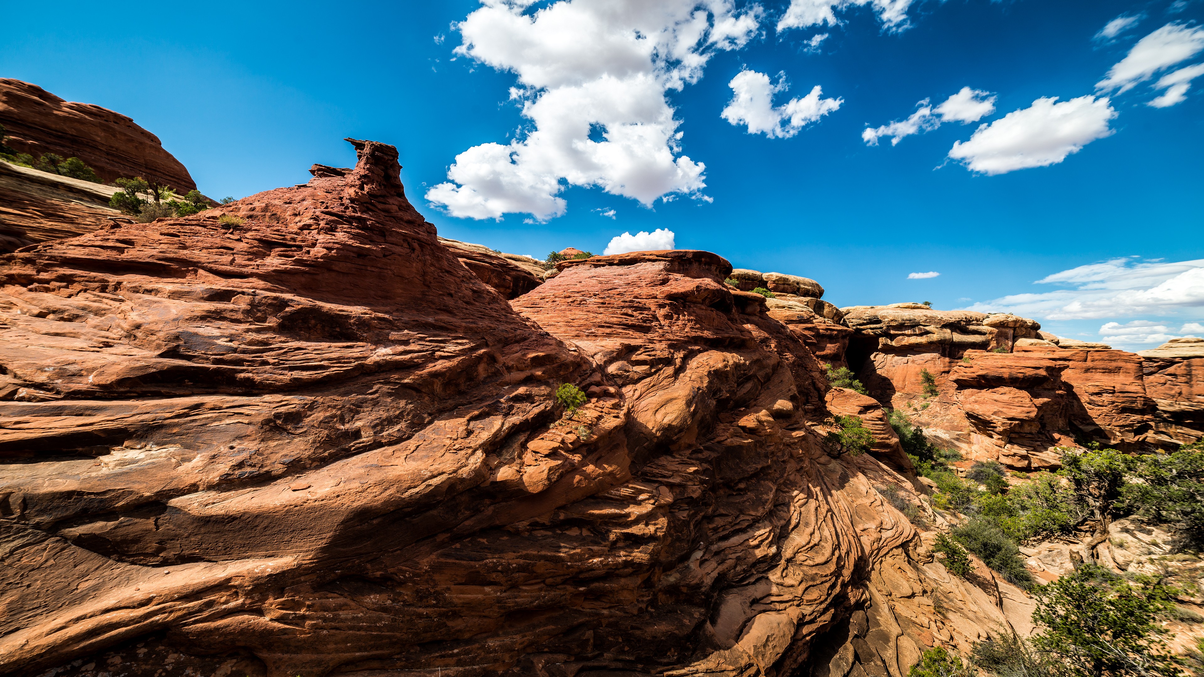 Red rock formations under a blue sky HD Wallpaper