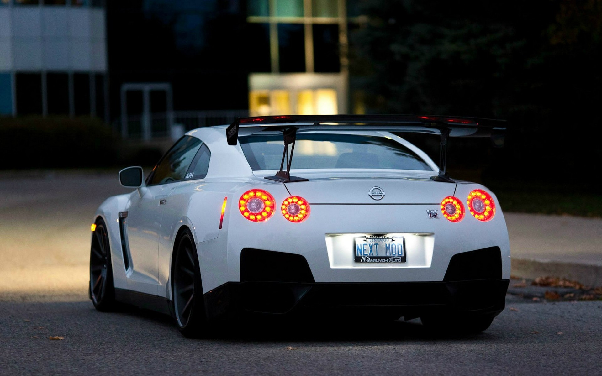 White Nissan GT-R R35 with a large rear spoiler HD Wallpaper