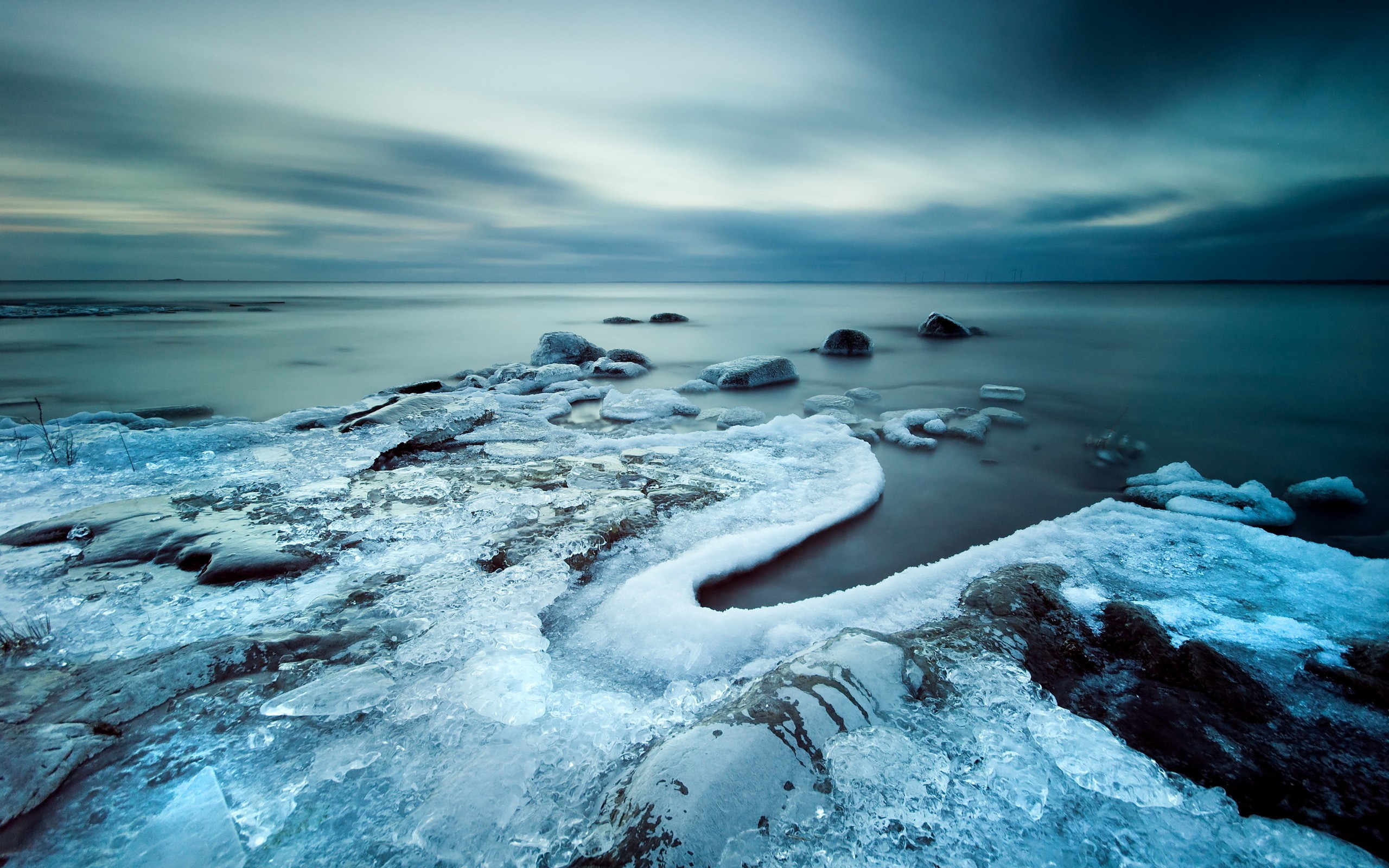 Frozen Coastline with Ice and Rocks in Long Exposure HD Wallpaper