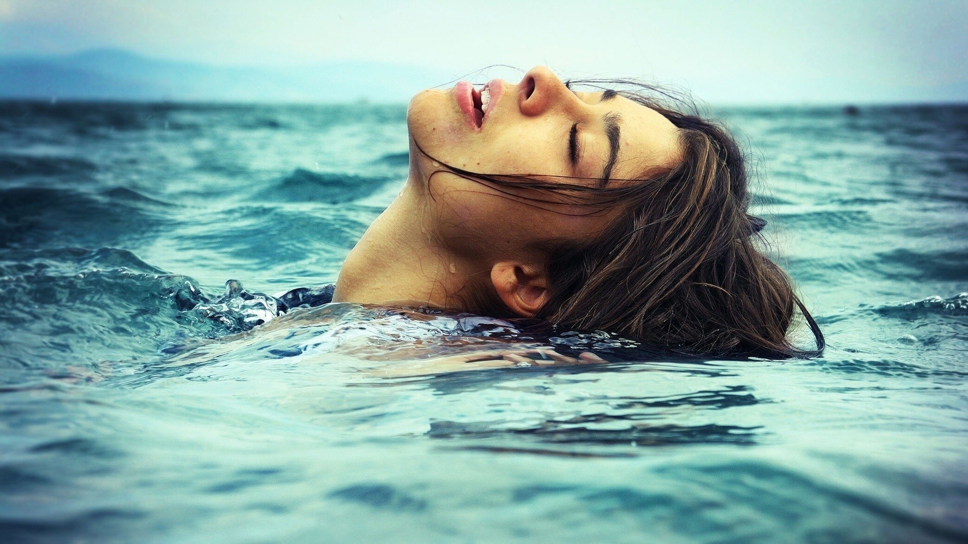 Woman with closed eyes in the water HD Wallpaper