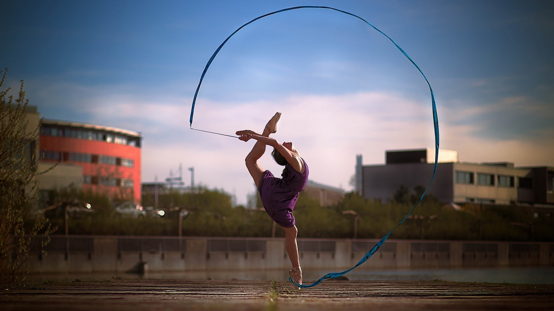 Woman performing gymnastics with a ribbon HD Wallpaper