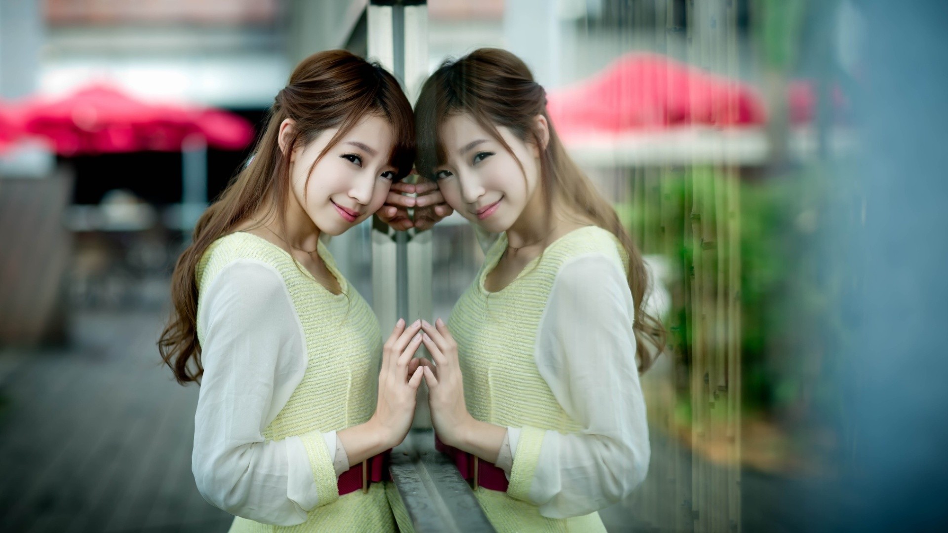 Asian woman leaning on a reflective surface HD Wallpaper