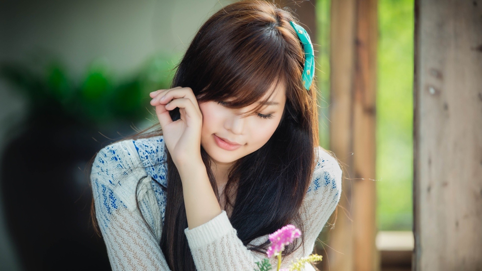 Asian woman with brown hair and a blue hair clip HD Wallpaper