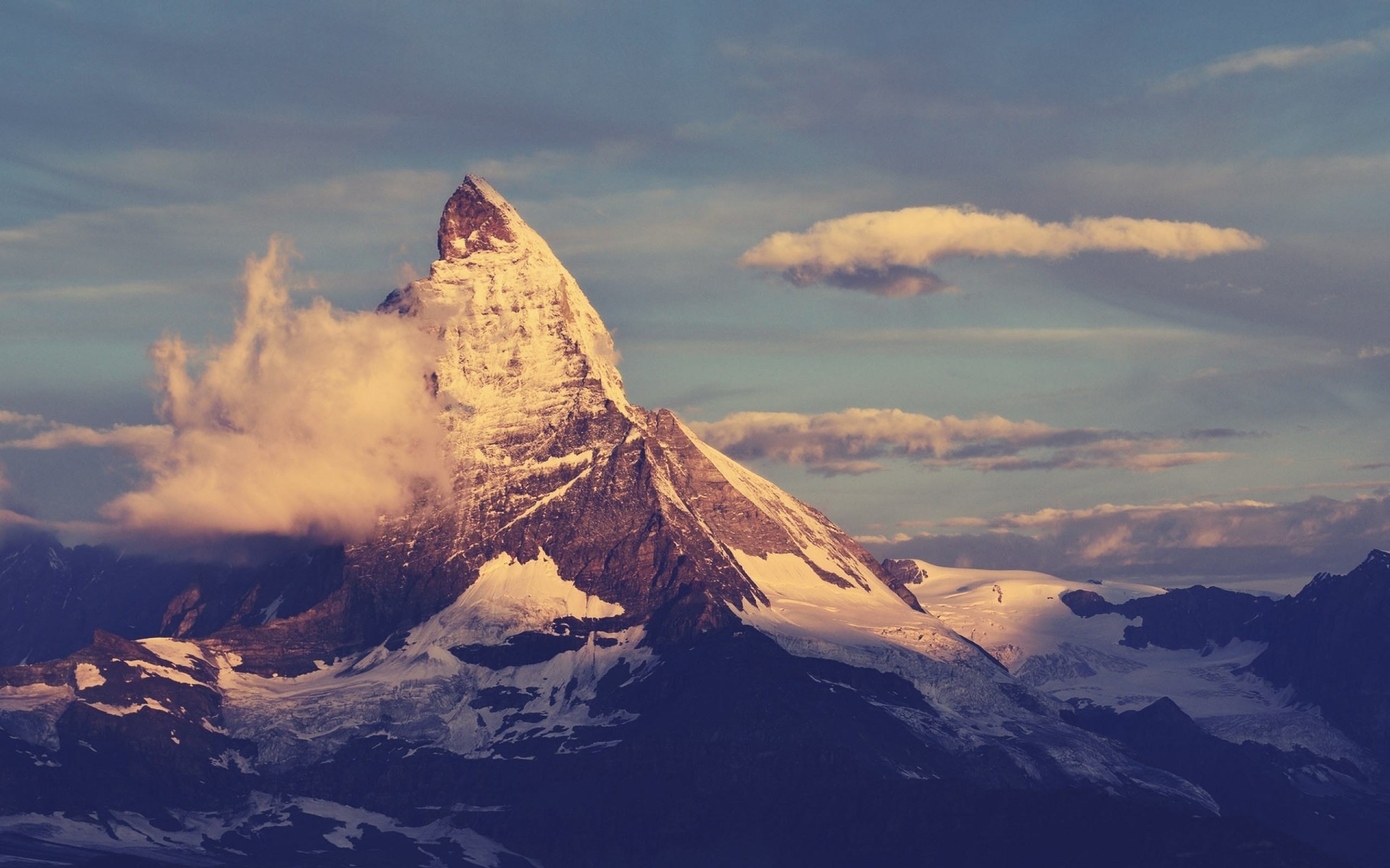 The Matterhorn mountain peak at sunset with clouds HD Wallpaper