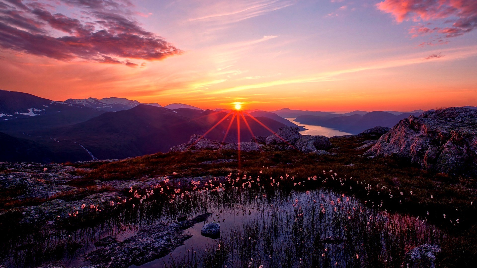 Sunset over mountains and a lake HD Wallpaper