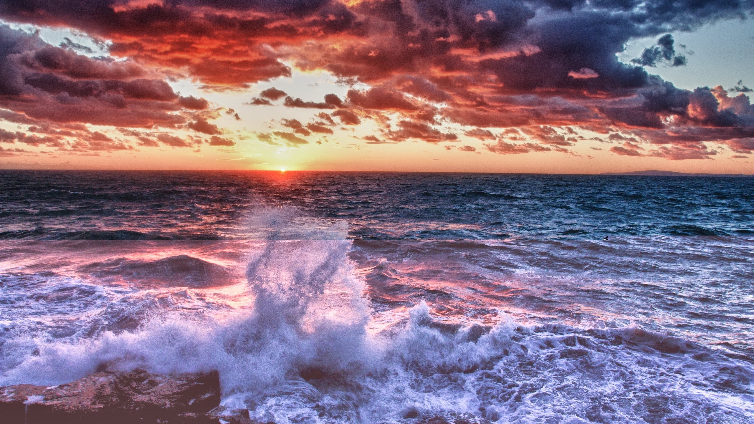 Sunset over the ocean with crashing waves HD Wallpaper