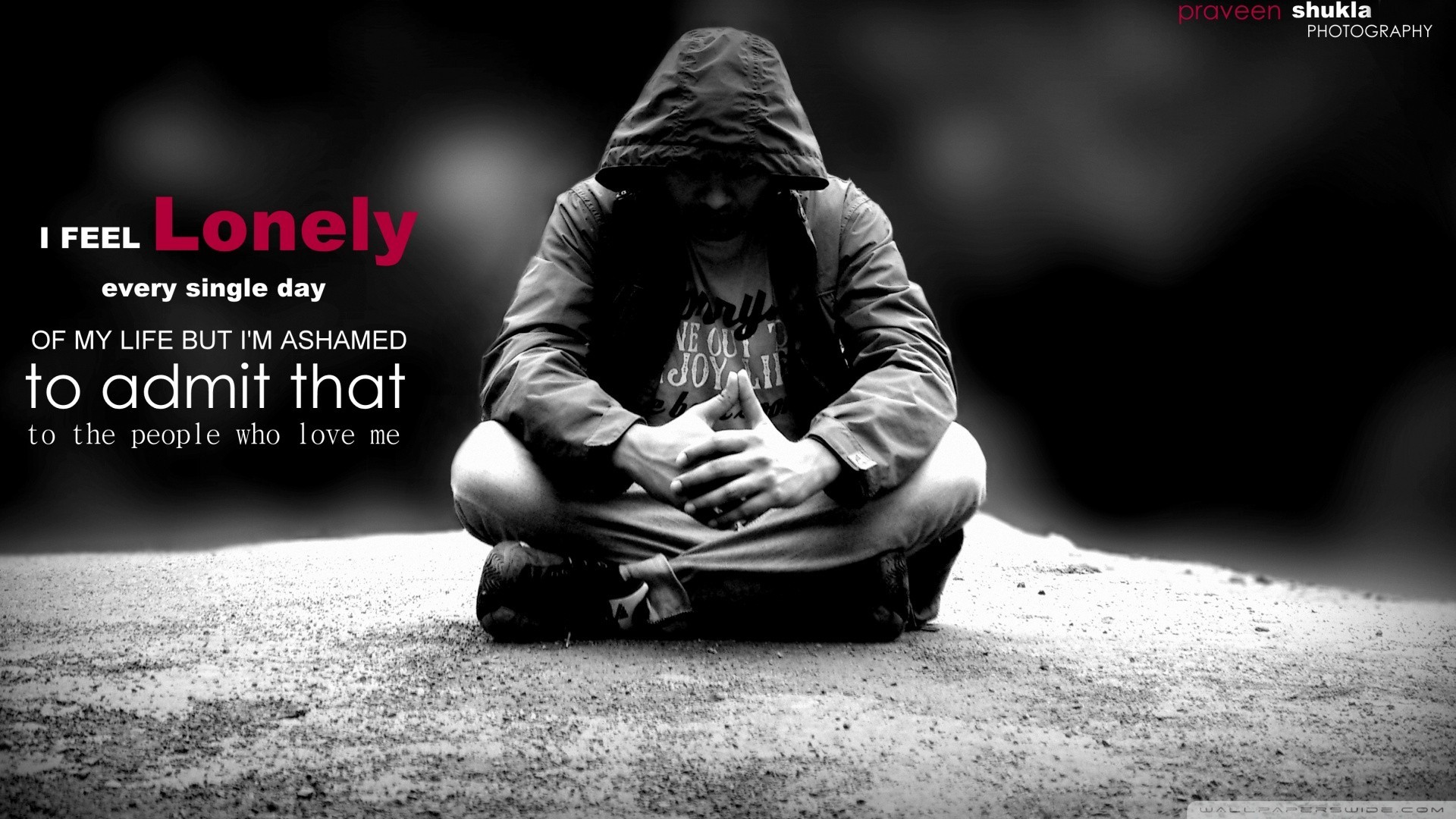 Man sitting alone with text overlay HD Wallpaper