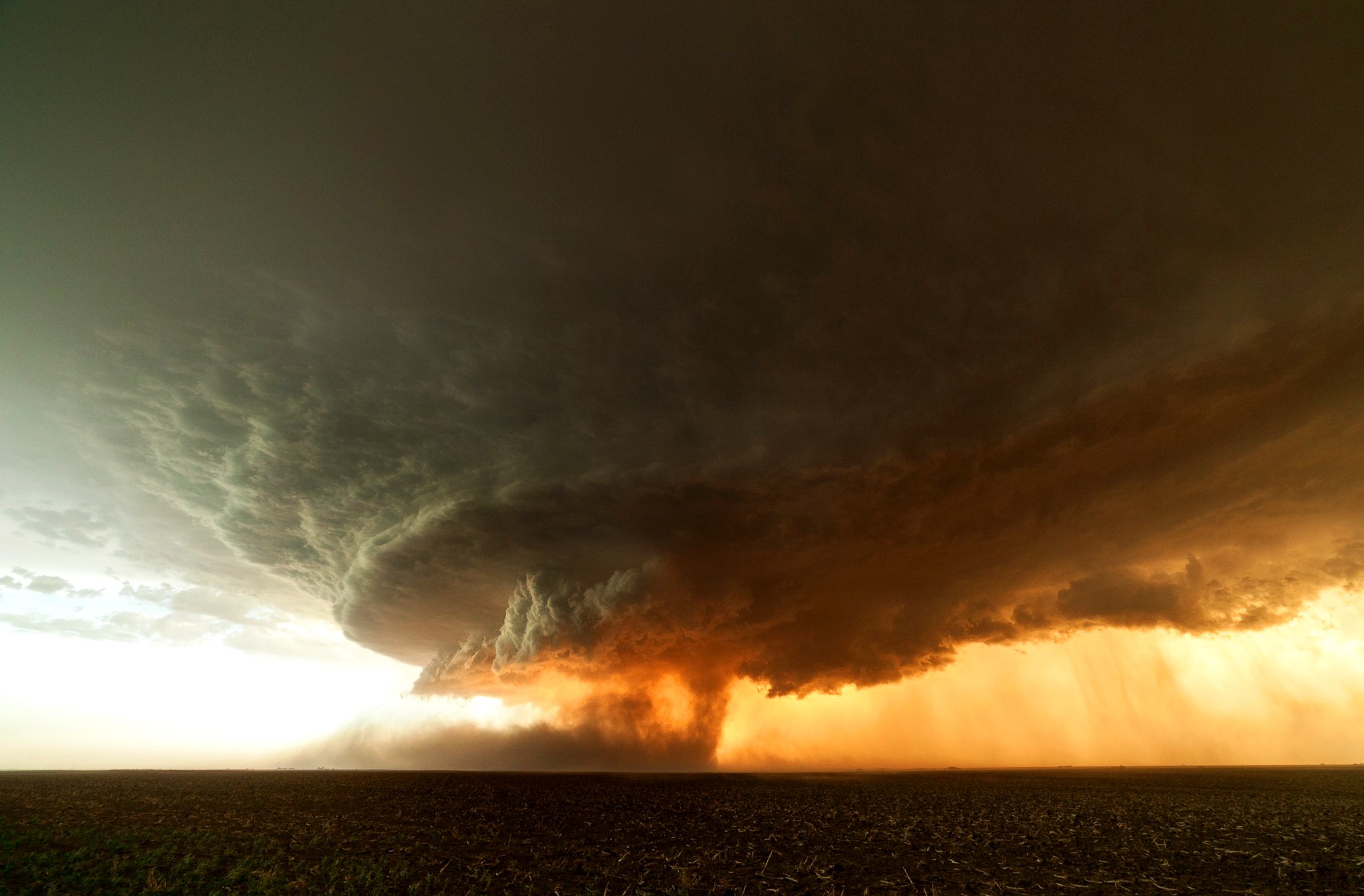 A massive tornado storm over a field HD Wallpaper