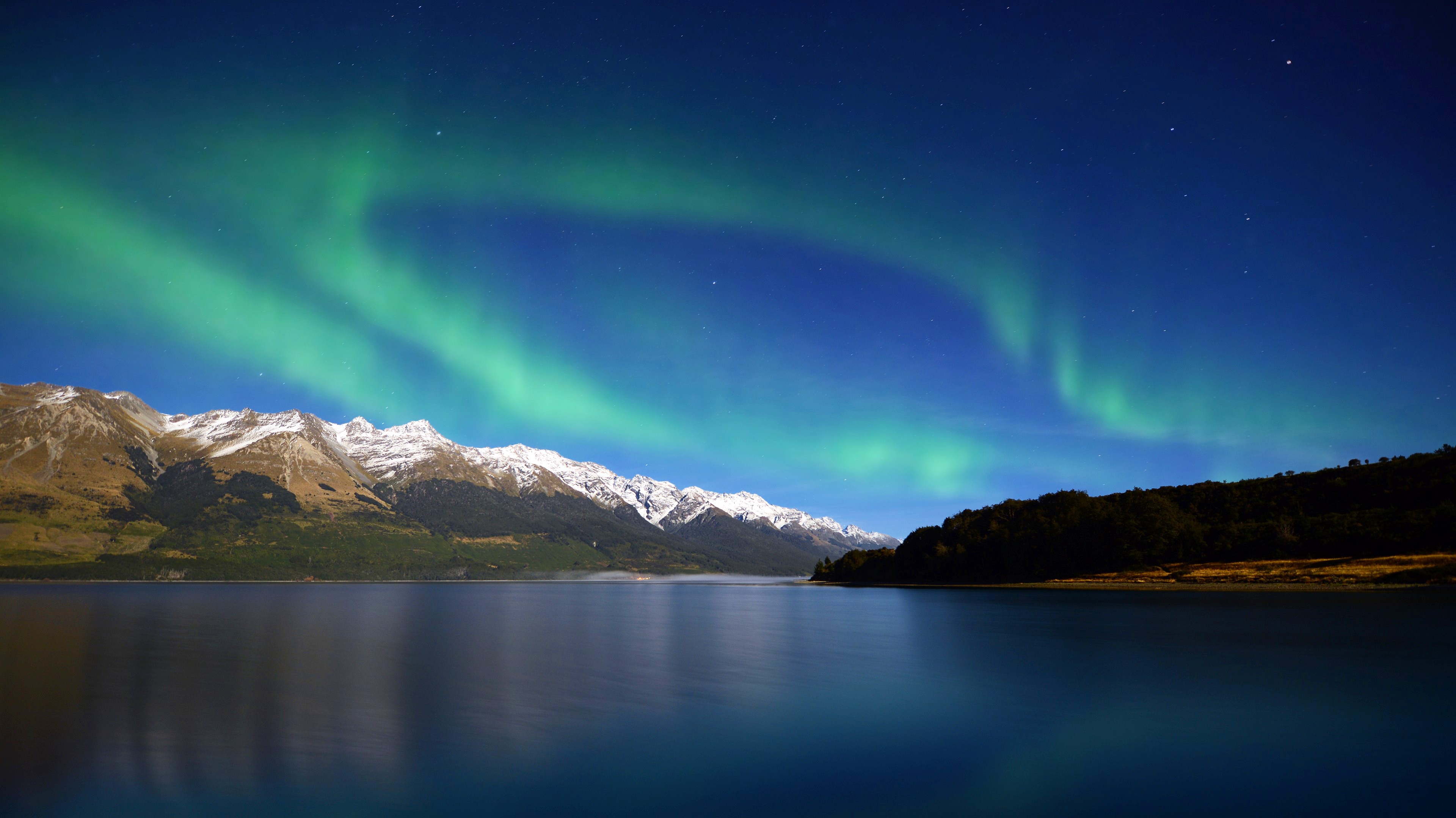 Aurora Borealis over snow-capped mountains and lake HD Wallpaper