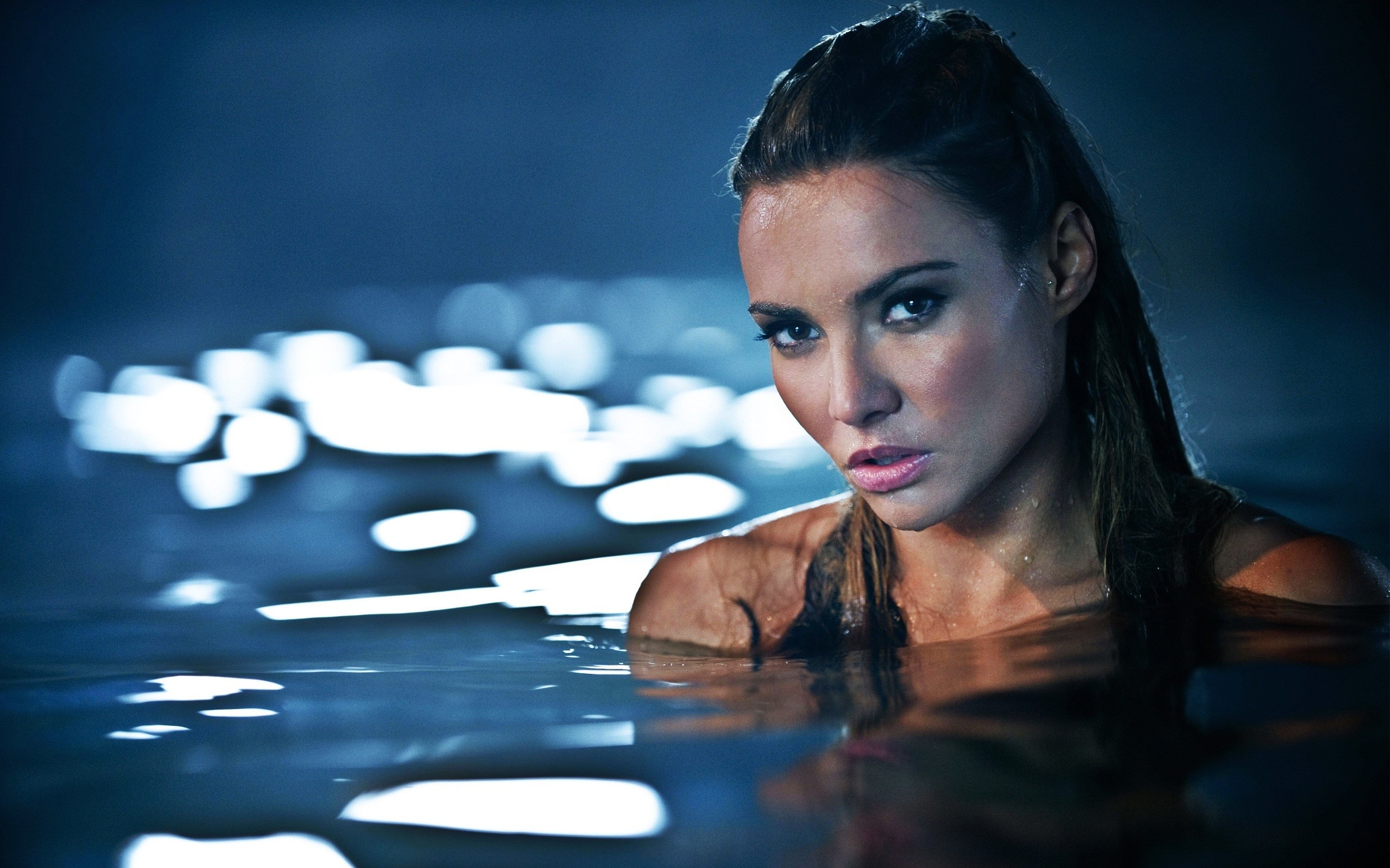 Woman with wet hair in dark water HD Wallpaper