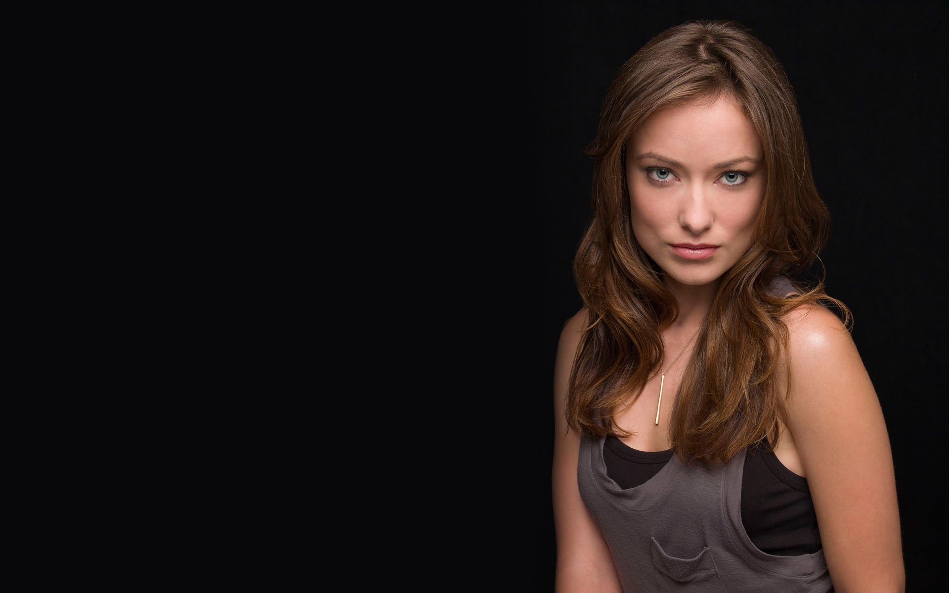 Olivia Wilde Poses Against a Black Background HD Wallpaper