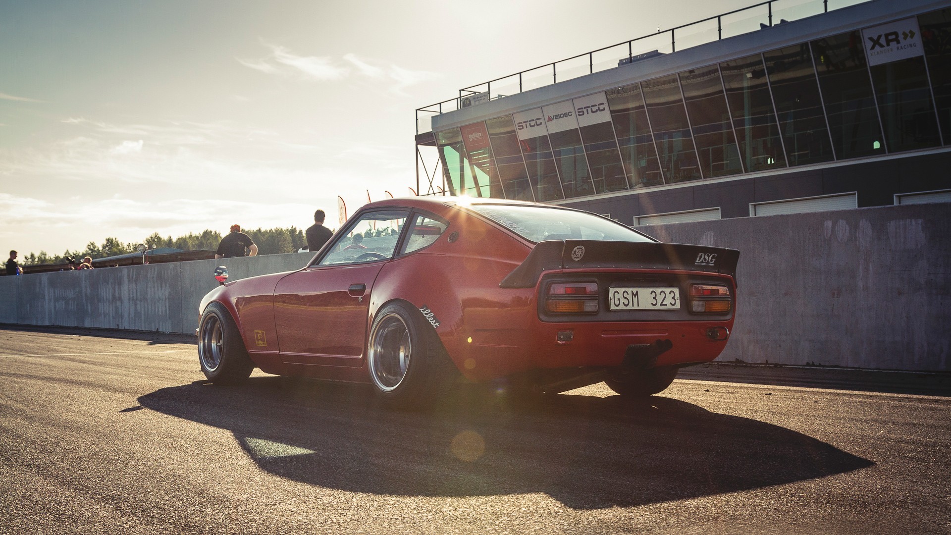 Red Datsun 240Z on a race track HD Wallpaper