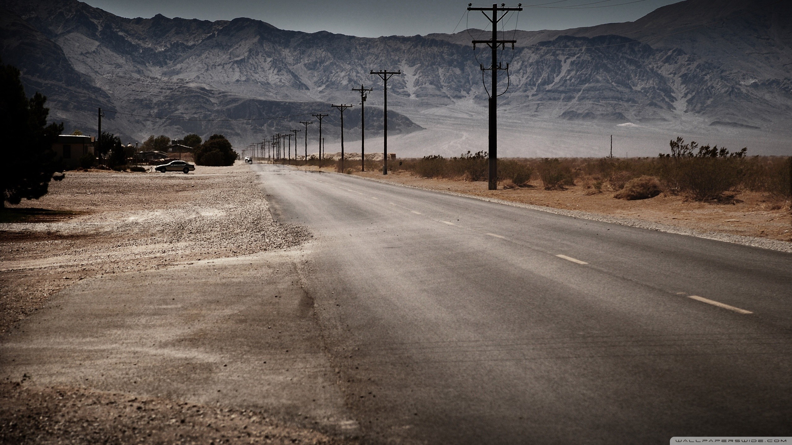 Desert road with mountains and power lines HD Wallpaper