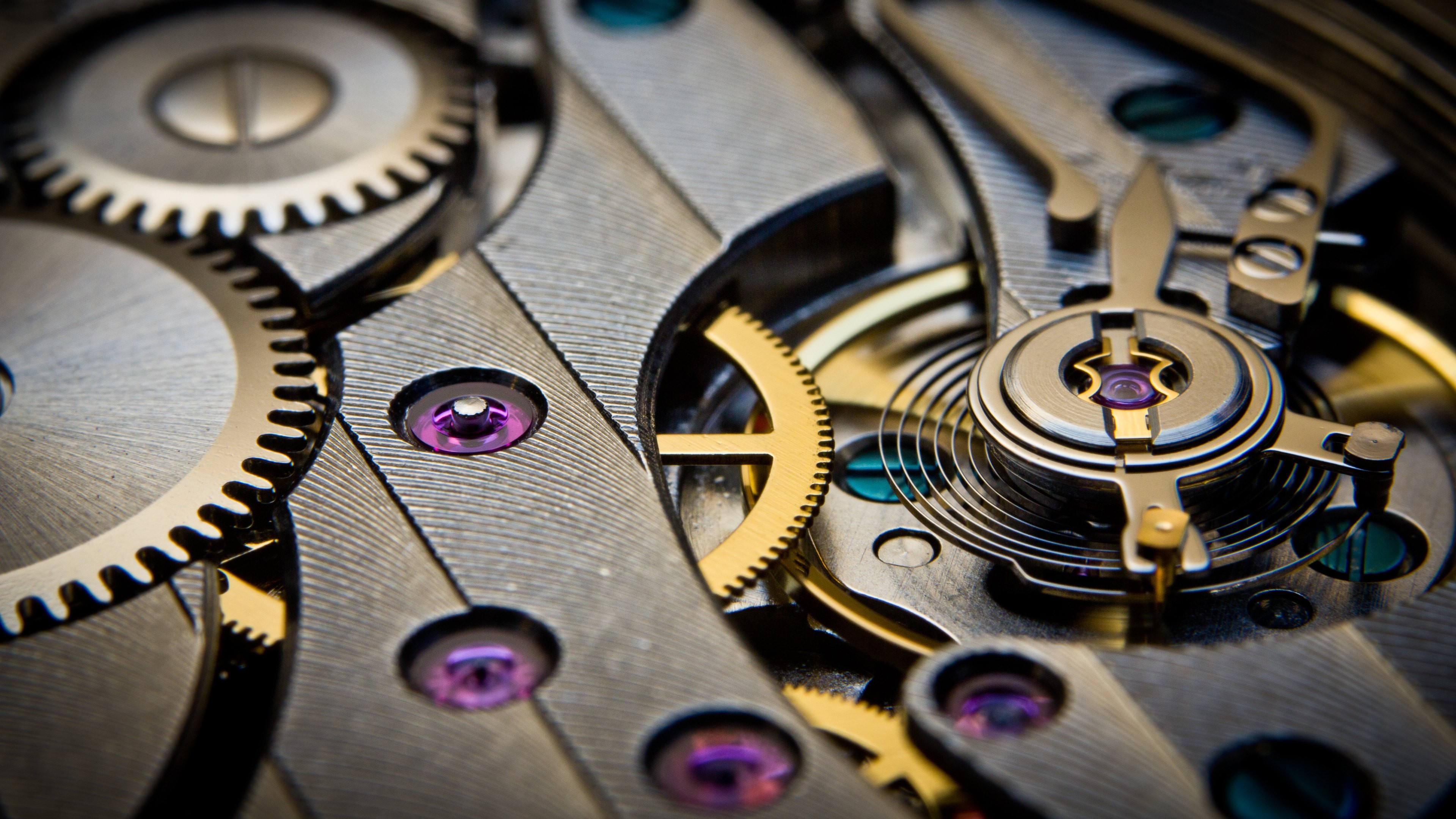 Close-up of a mechanical watch movement with gears HD Wallpaper