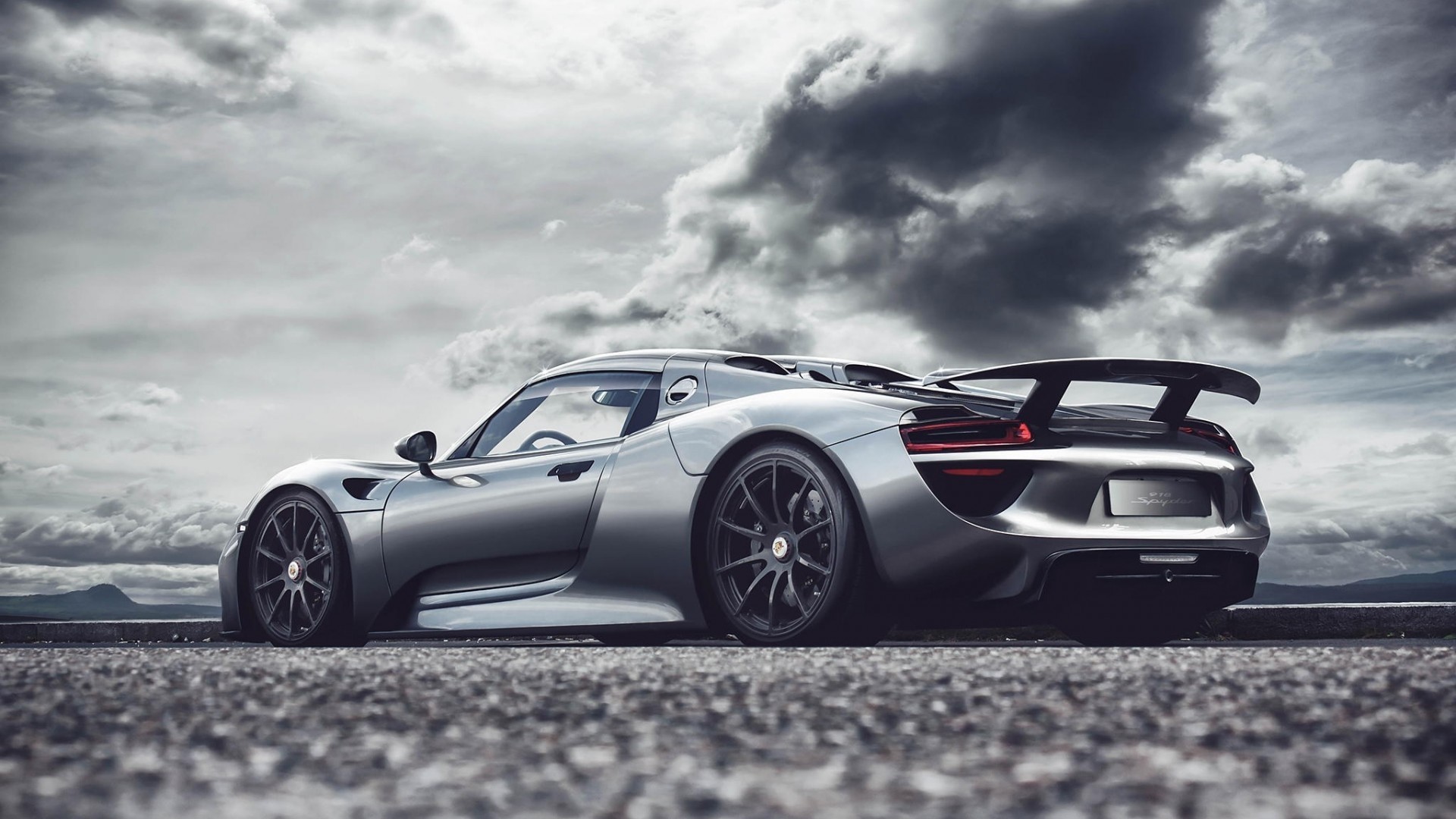 Porsche 918 Spyder sports car on a road HD Wallpaper