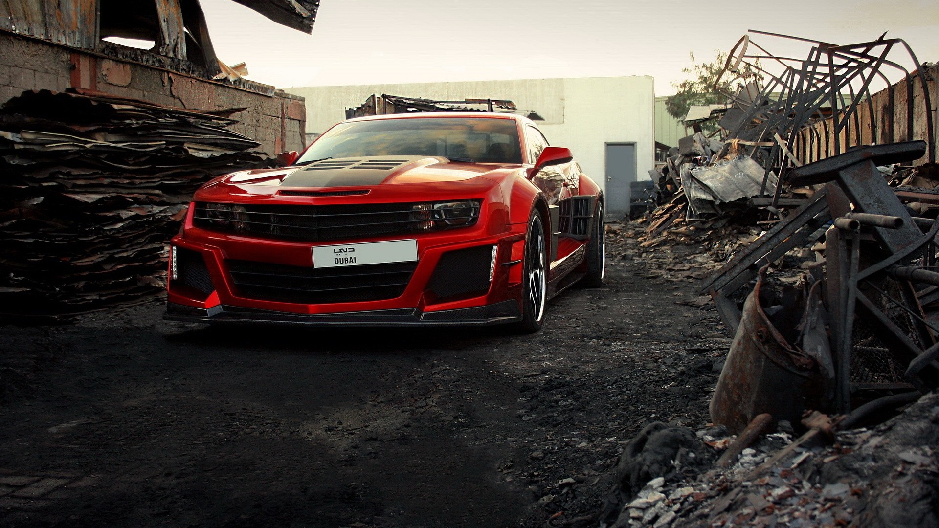 Red Chevrolet Camaro in a junkyard HD Wallpaper