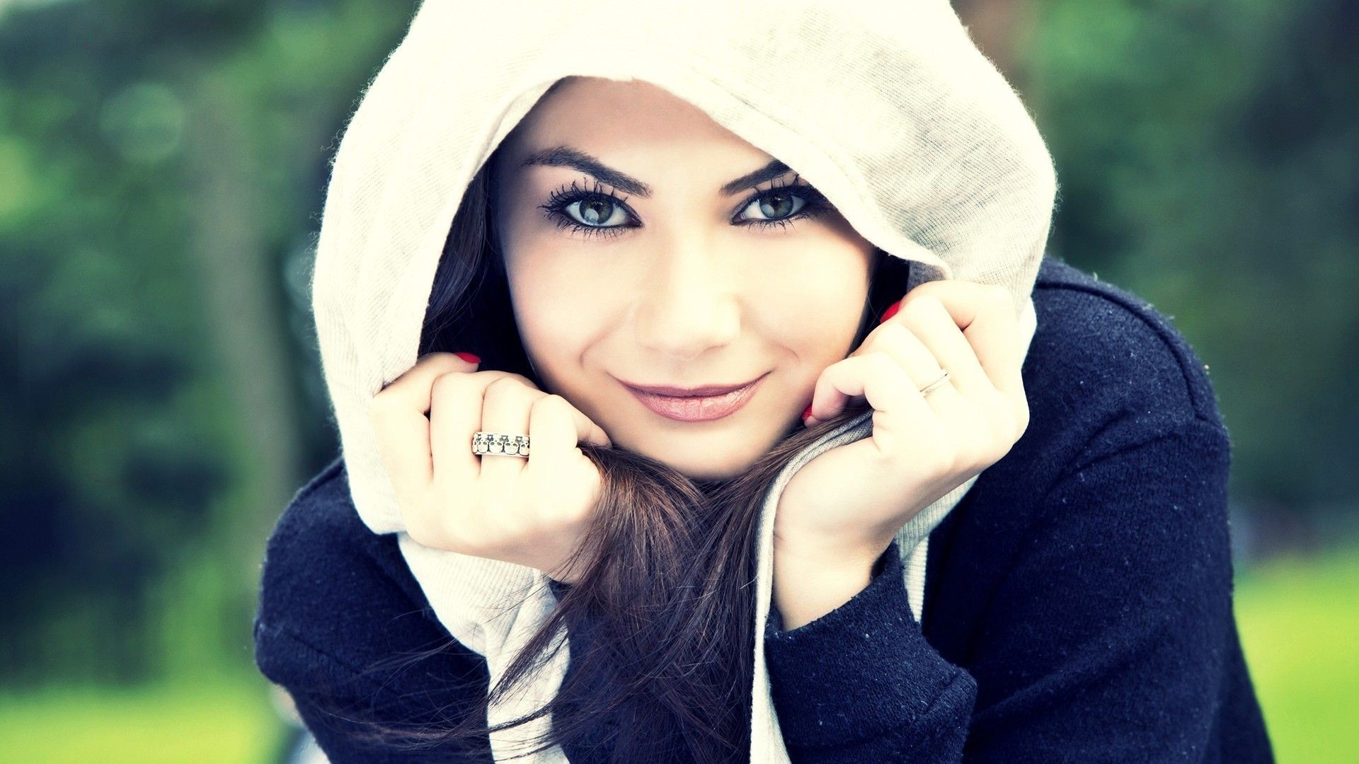 Woman wearing a hooded jacket outdoors HD Wallpaper