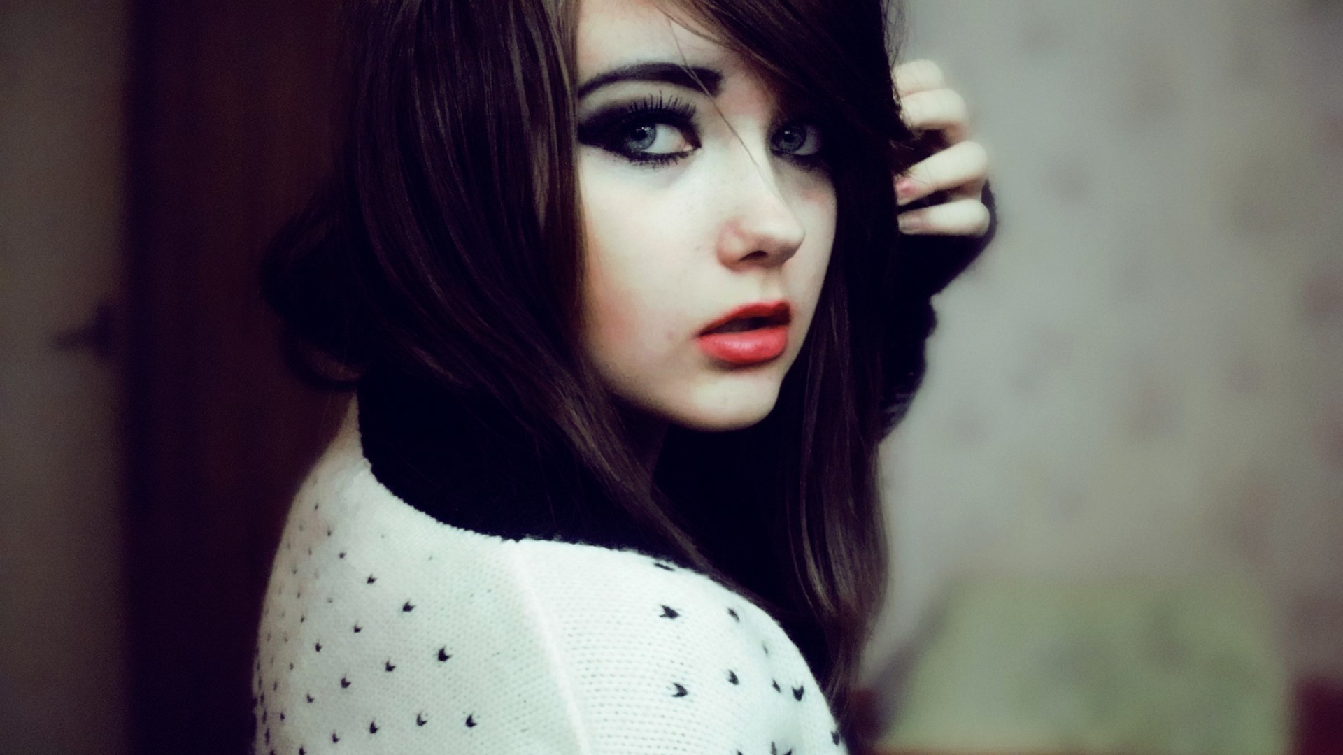 Woman with dark hair and makeup HD Wallpaper