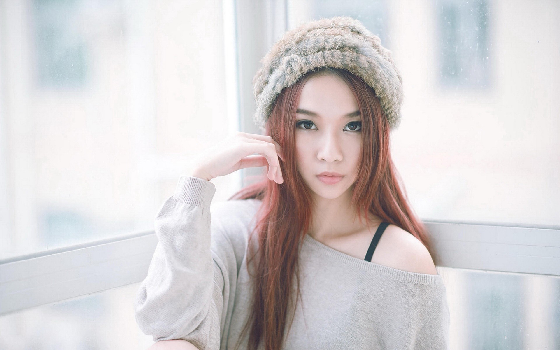 Asian woman with long hair wearing a fur hat HD Wallpaper