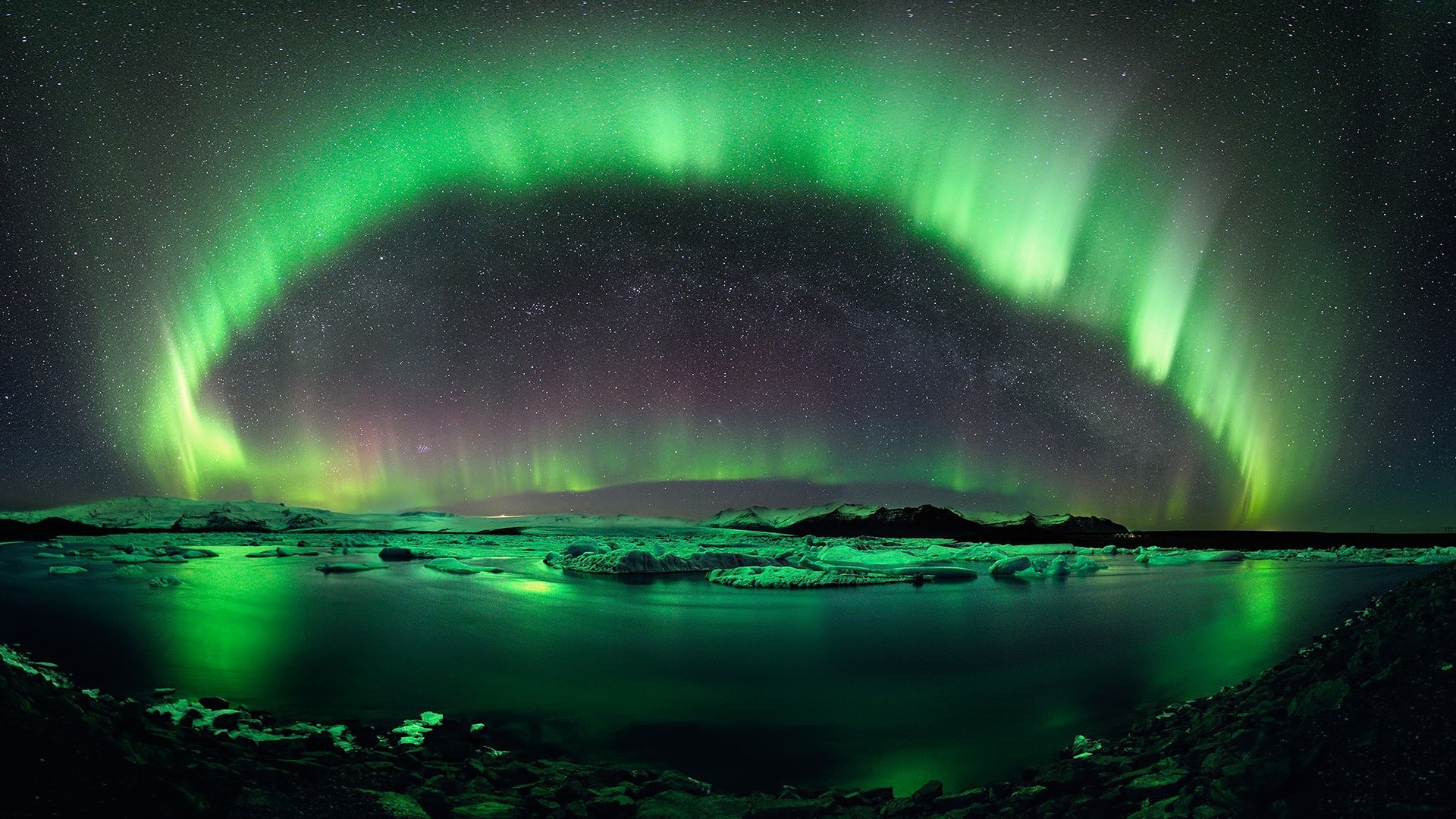 Aurora Borealis over a glacial lagoon at night HD Wallpaper