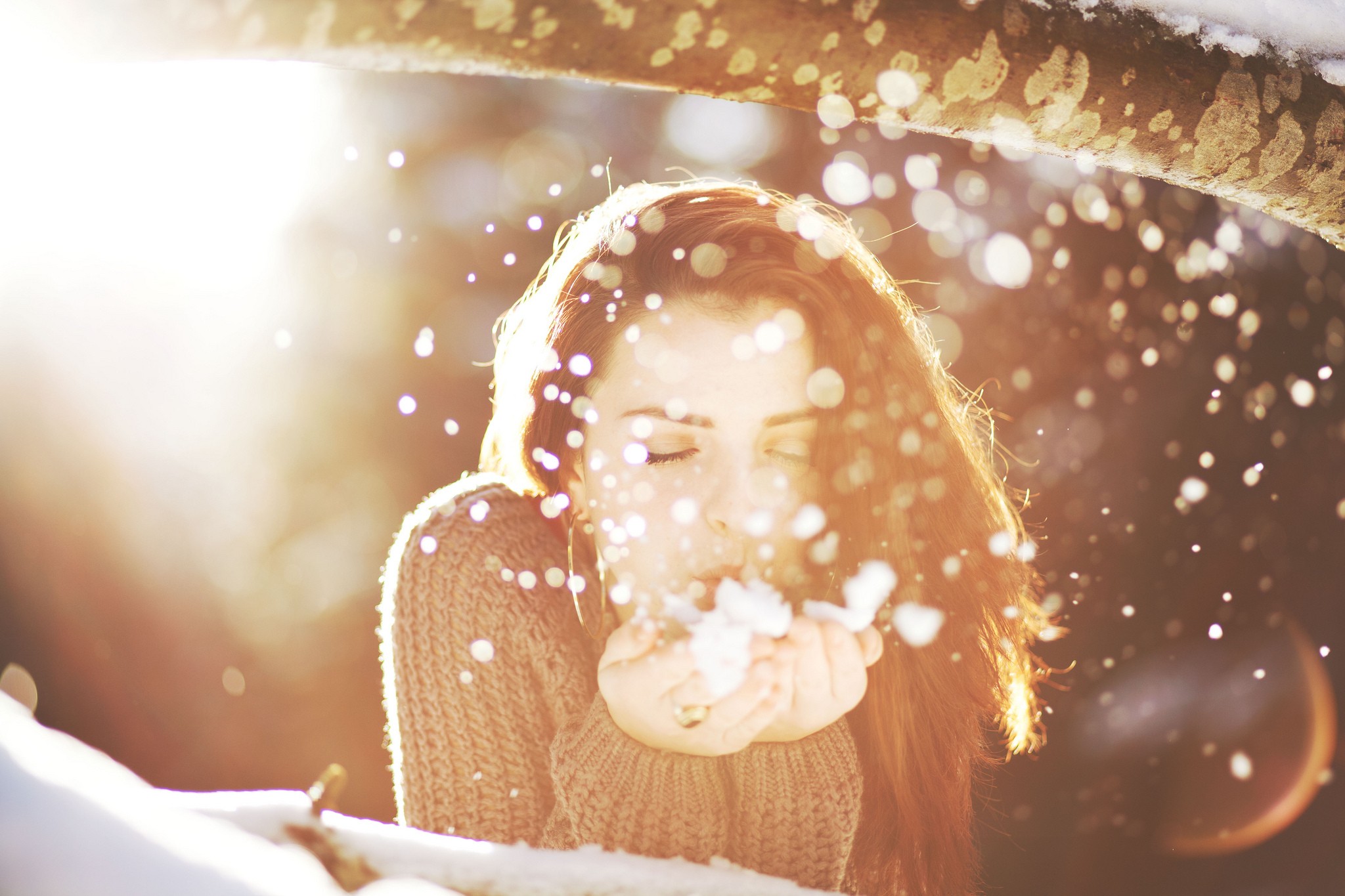 Woman blowing snow in sunlight HD Wallpaper