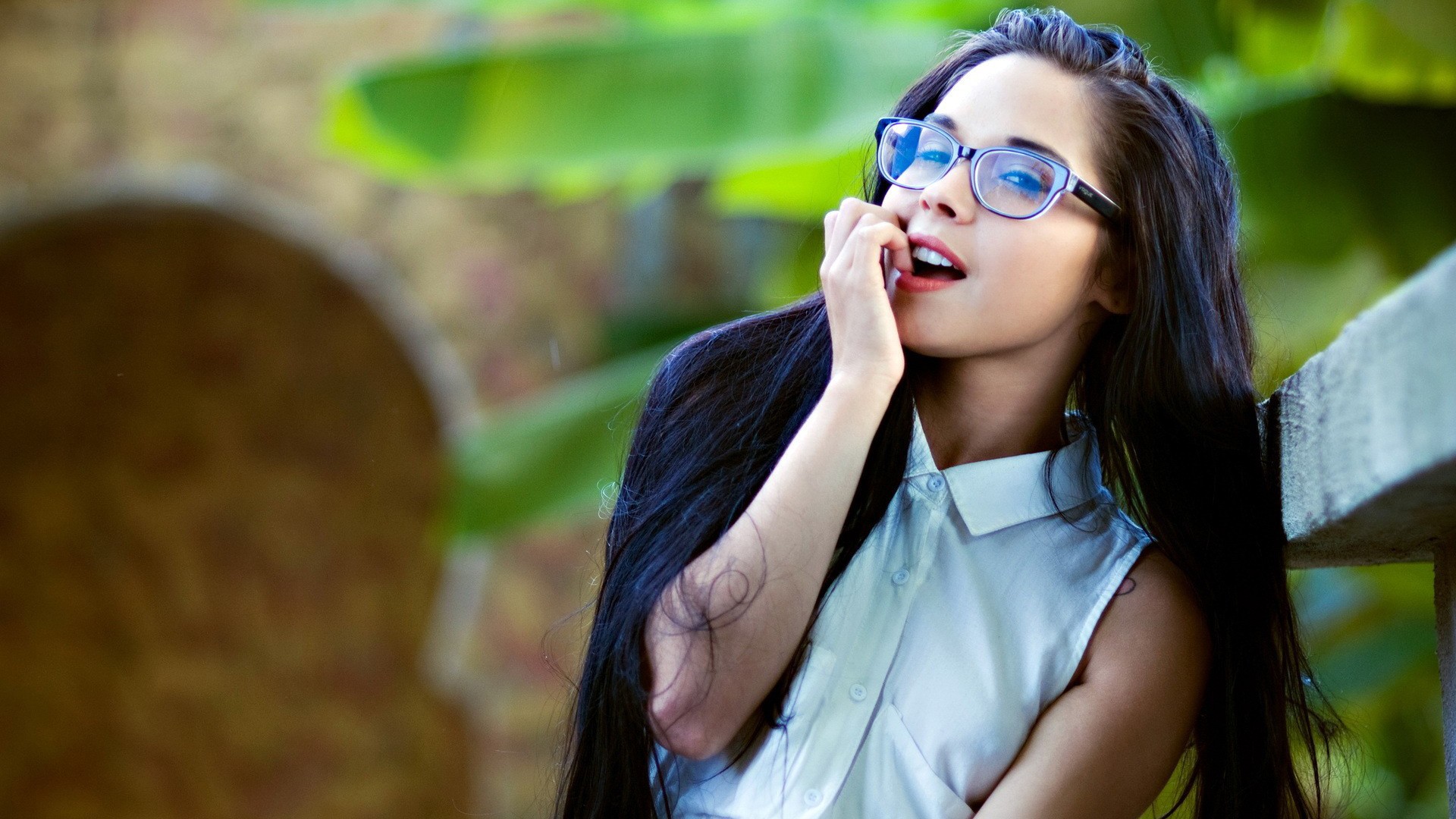 Woman with long dark hair and glasses HD Wallpaper
