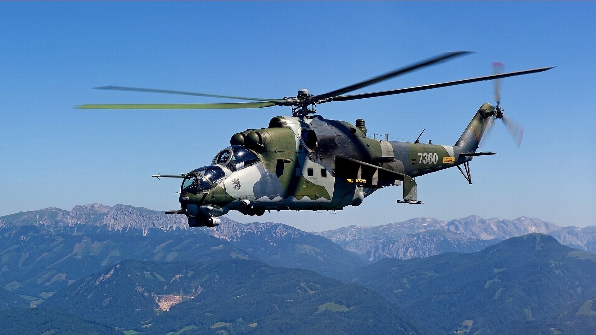 Mil Mi-24 Hind helicopter flying over mountains HD Wallpaper