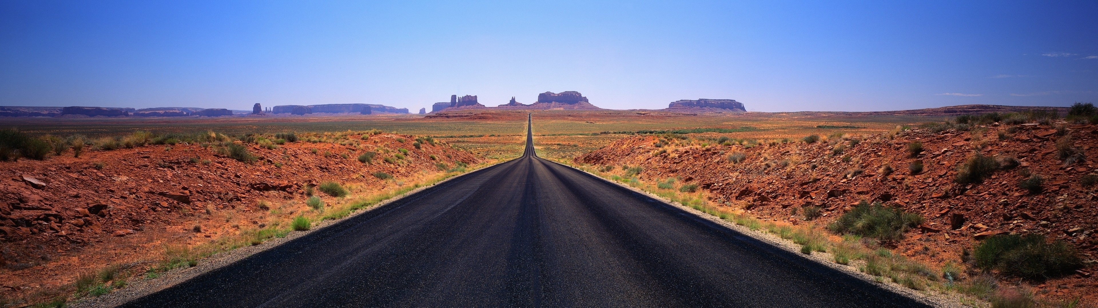 Highway through Monument Valley desert landscape HD Wallpaper
