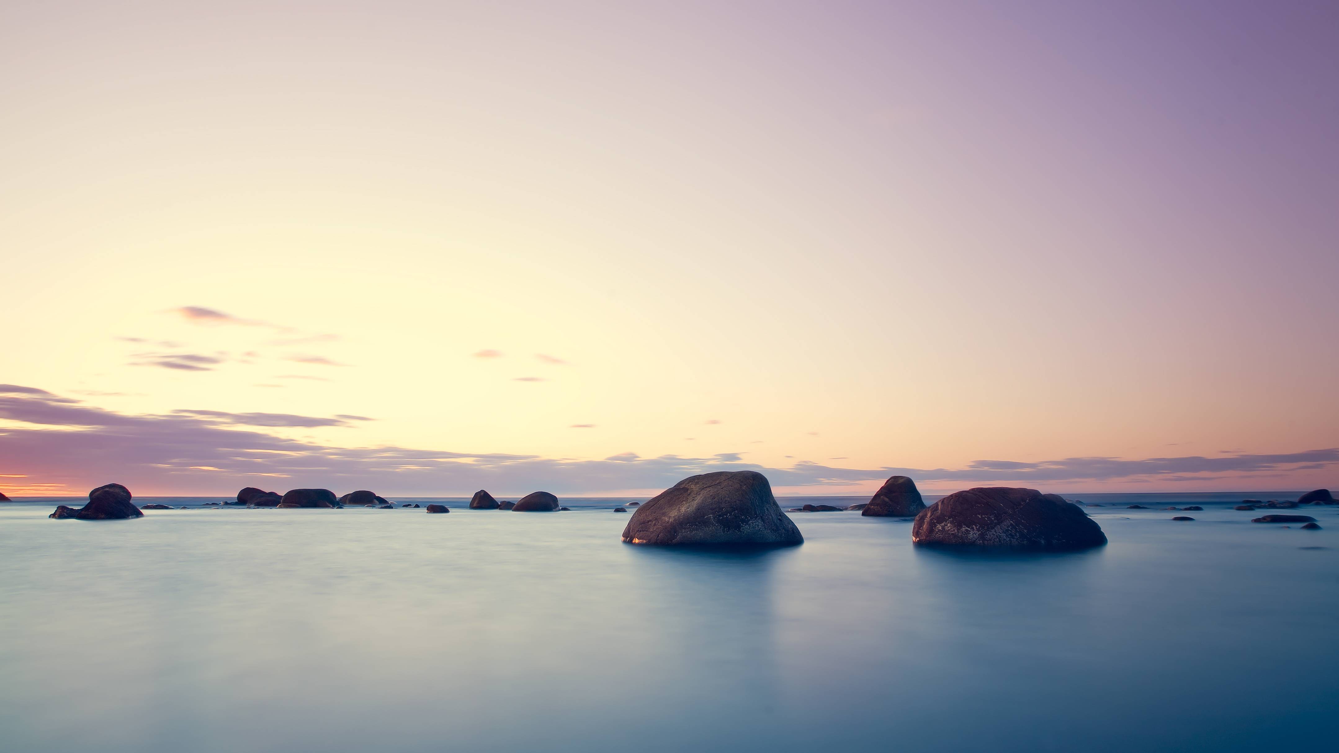 Rocks in the sea at sunset HD Wallpaper