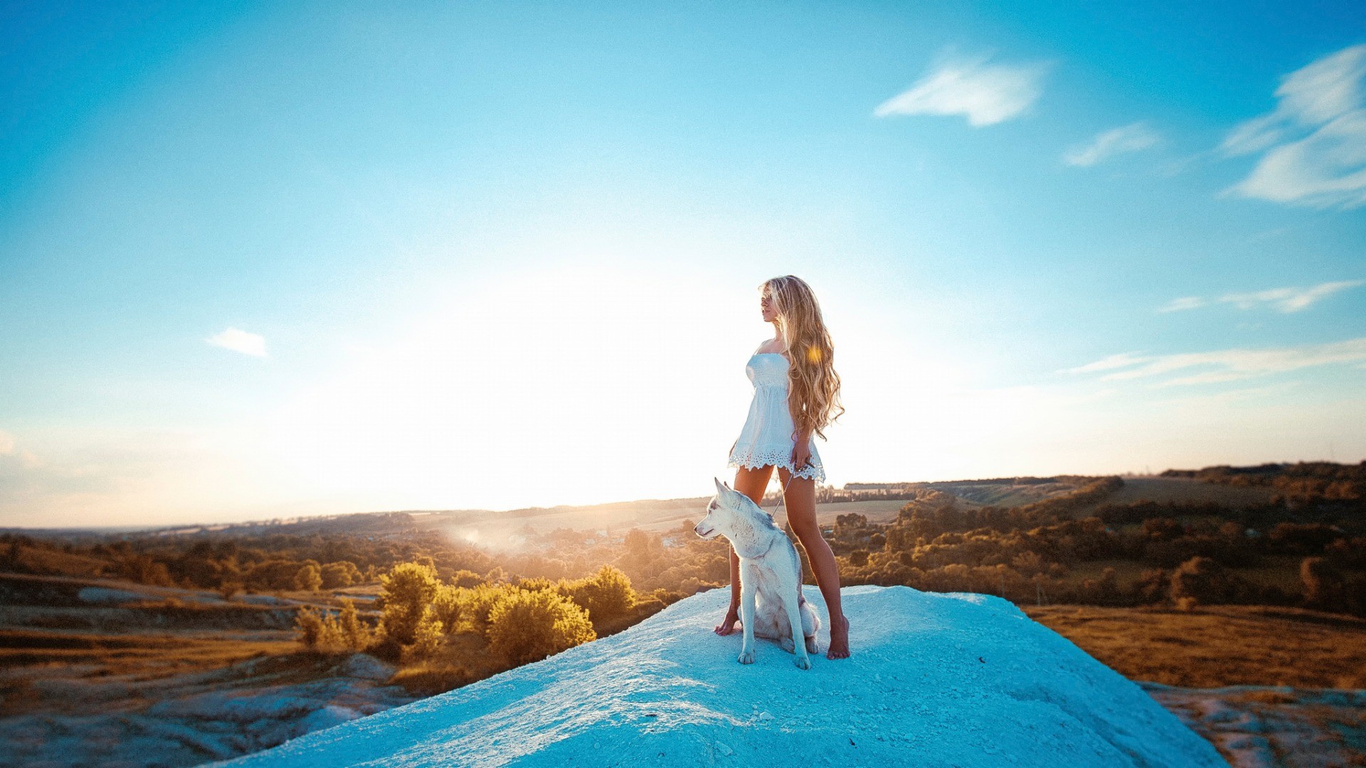 Woman with long hair and dog on a hill HD Wallpaper