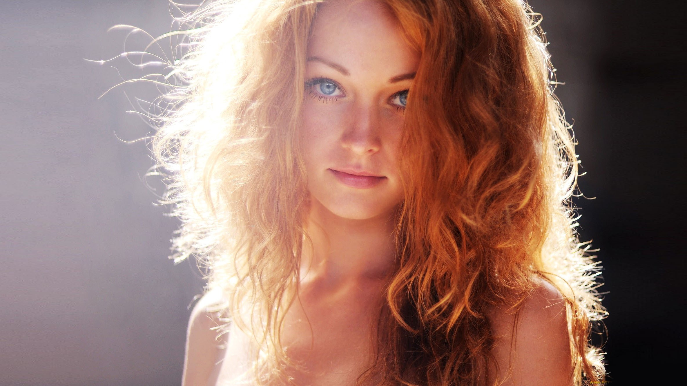 Redhead woman with blue eyes in sunlight HD Wallpaper