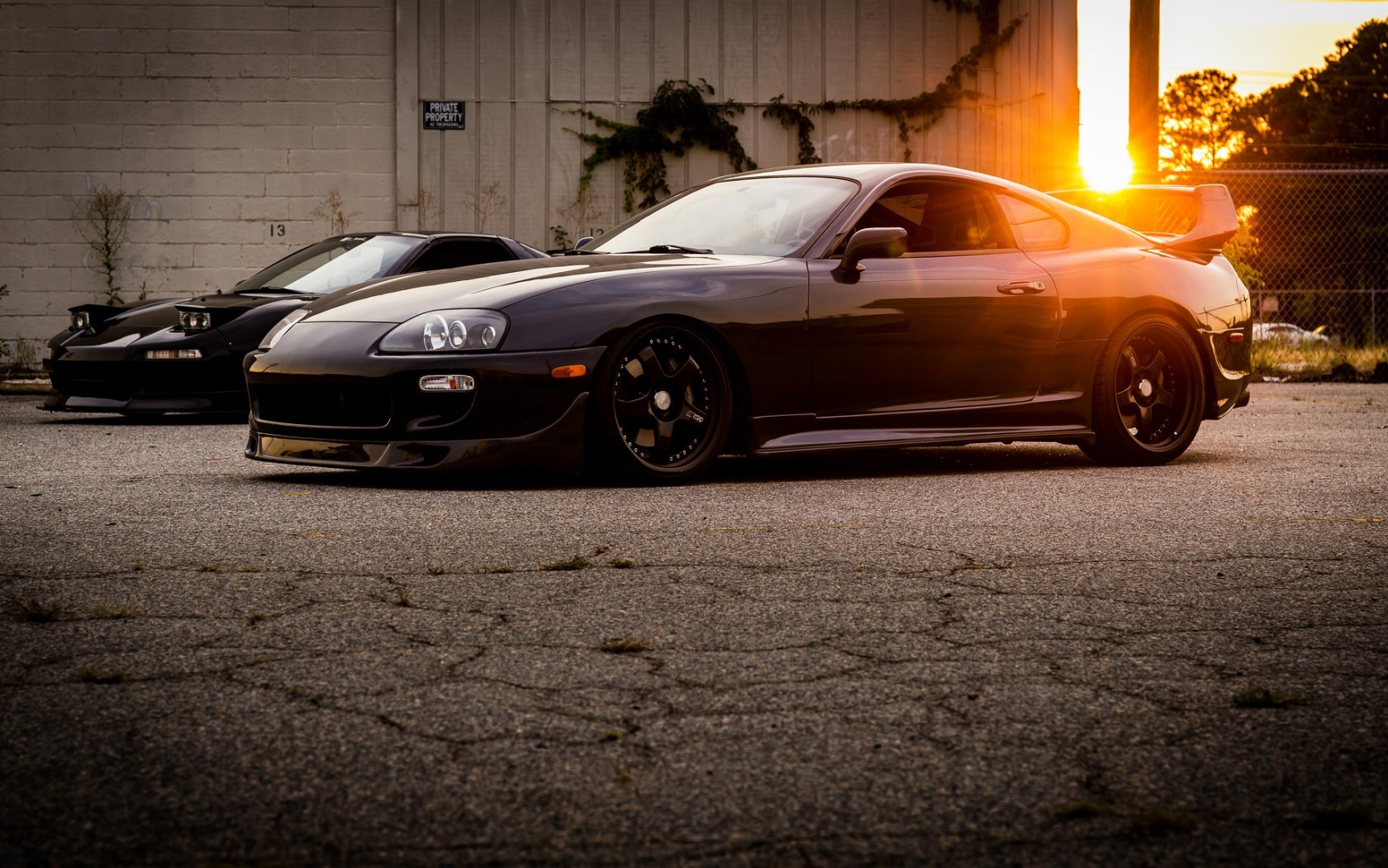 Two Toyota sports cars parked at sunset HD Wallpaper