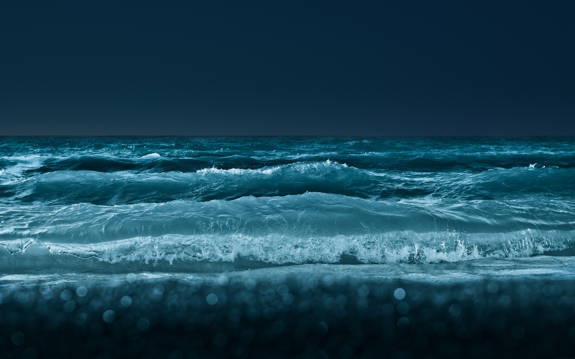 Dark blue sea with crashing waves and bokeh HD Wallpaper