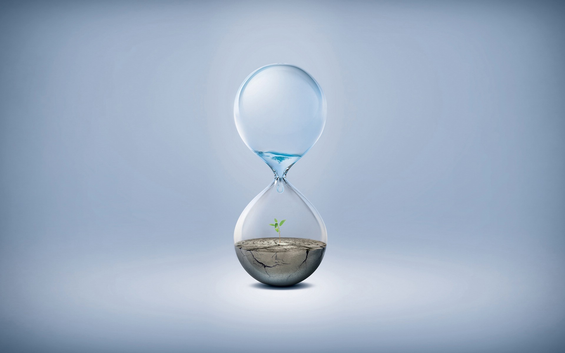 Hourglass with water and a plant growing HD Wallpaper