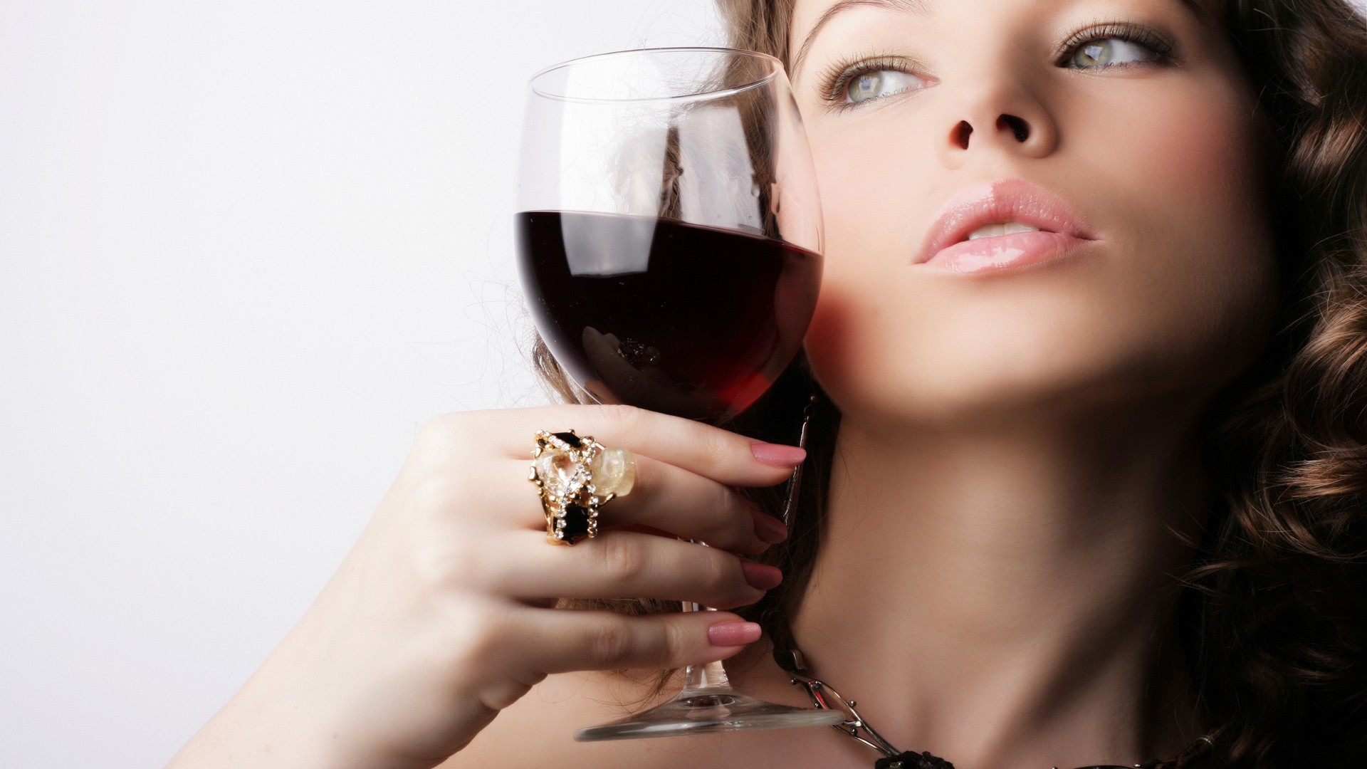 Woman holding a glass of red wine HD Wallpaper