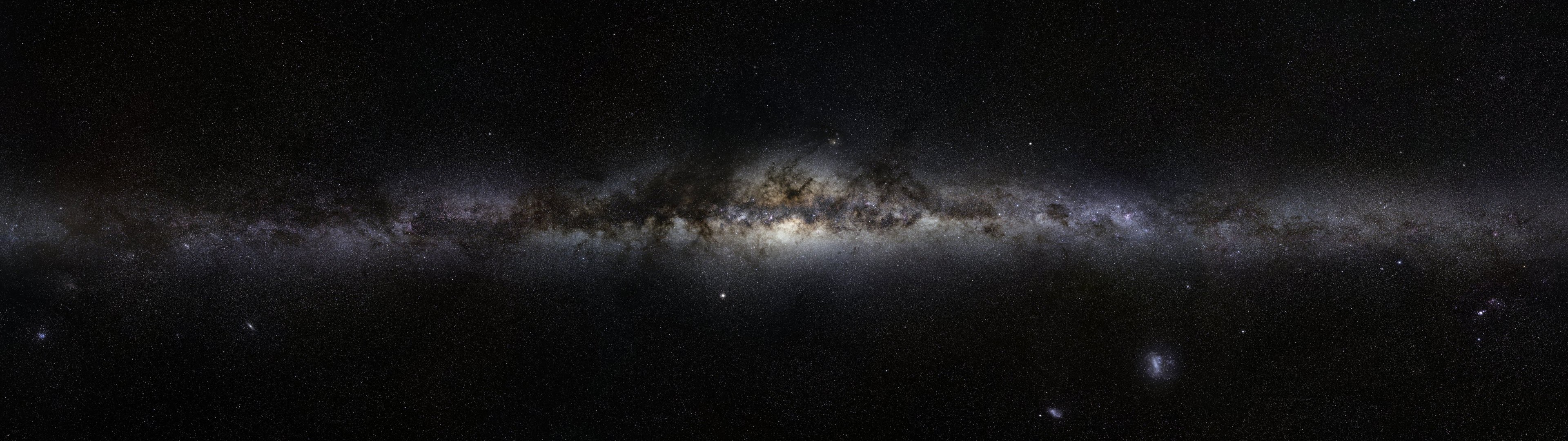 The Milky Way galaxy stretches across the dark sky HD Wallpaper