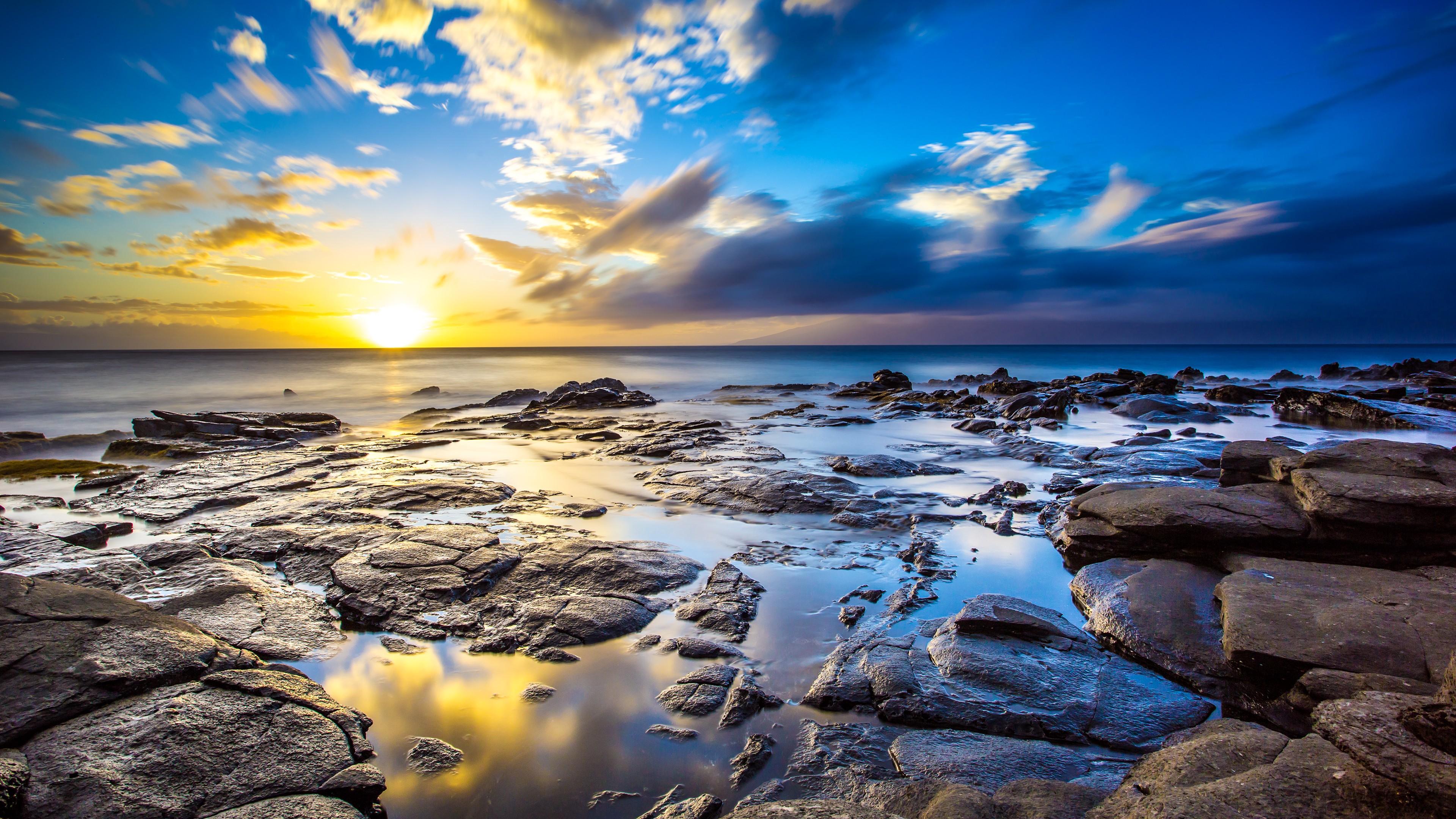 Sunset over rocky coast with ocean and clouds HD Wallpaper
