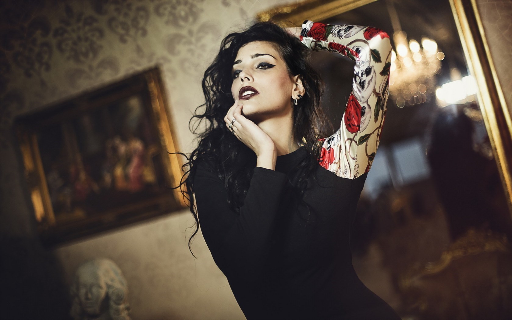 Woman with dark hair and tattoos in a room HD Wallpaper