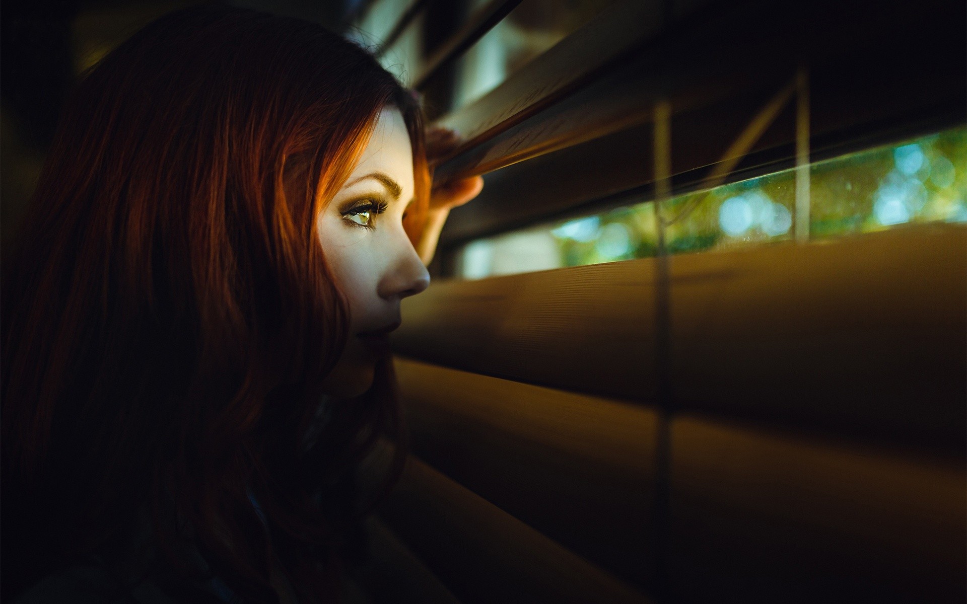 Redhead woman looking through blinds HD Wallpaper