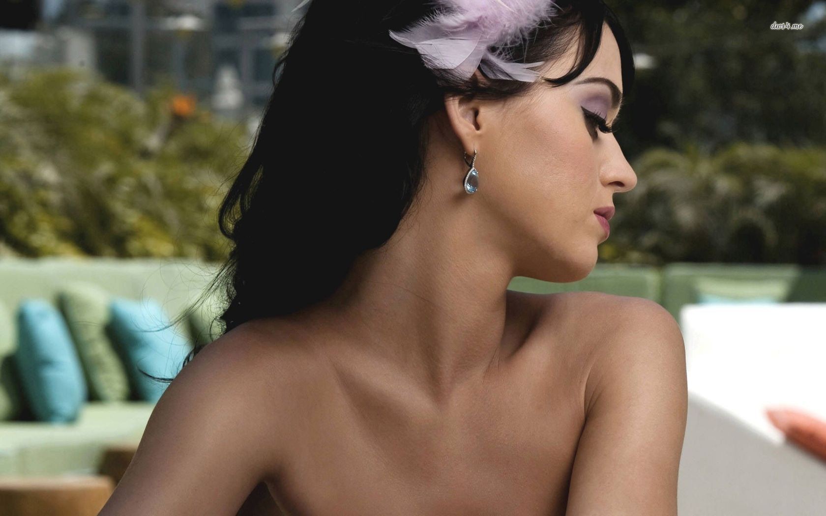 Katy Perry in profile with a feather in her hair HD Wallpaper