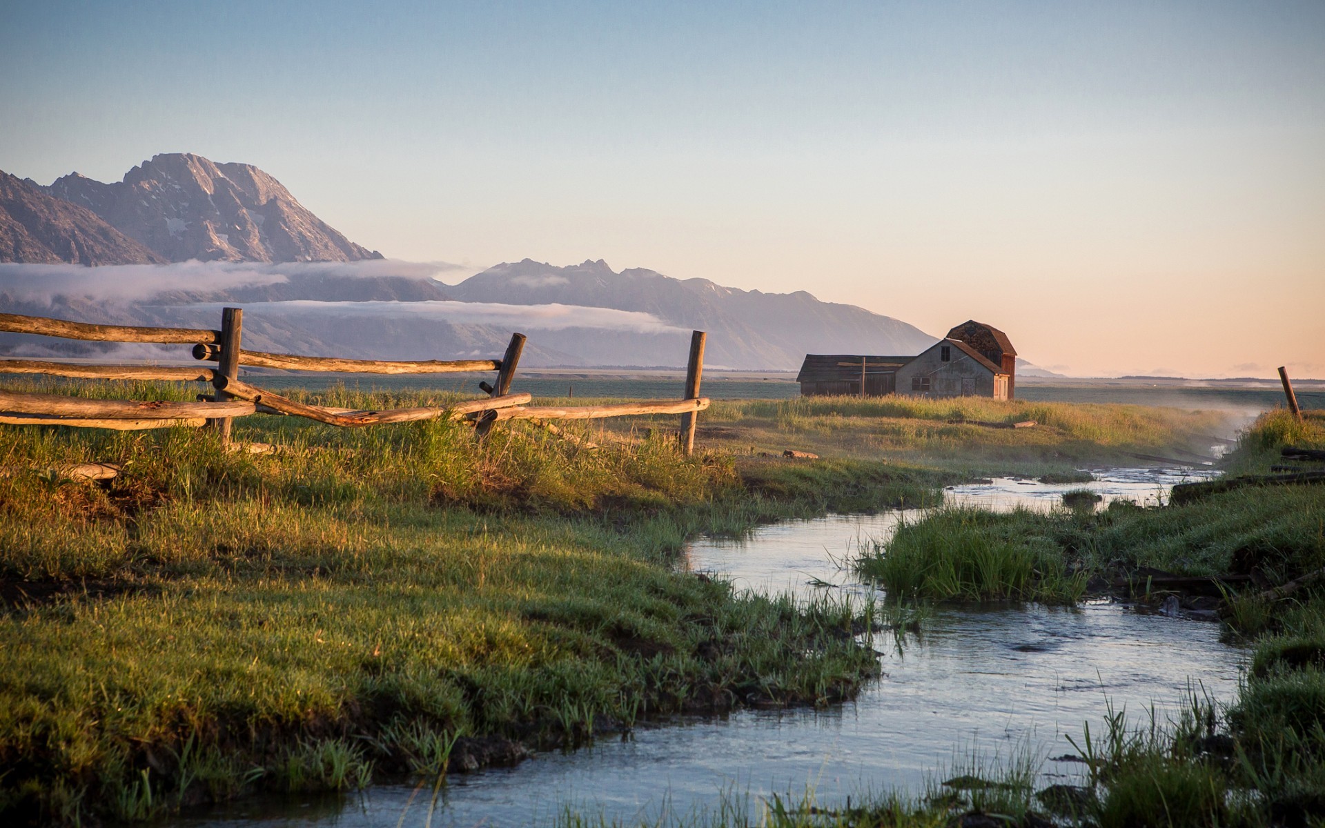 Barn and fence in a mountain landscape at sunrise HD Wallpaper